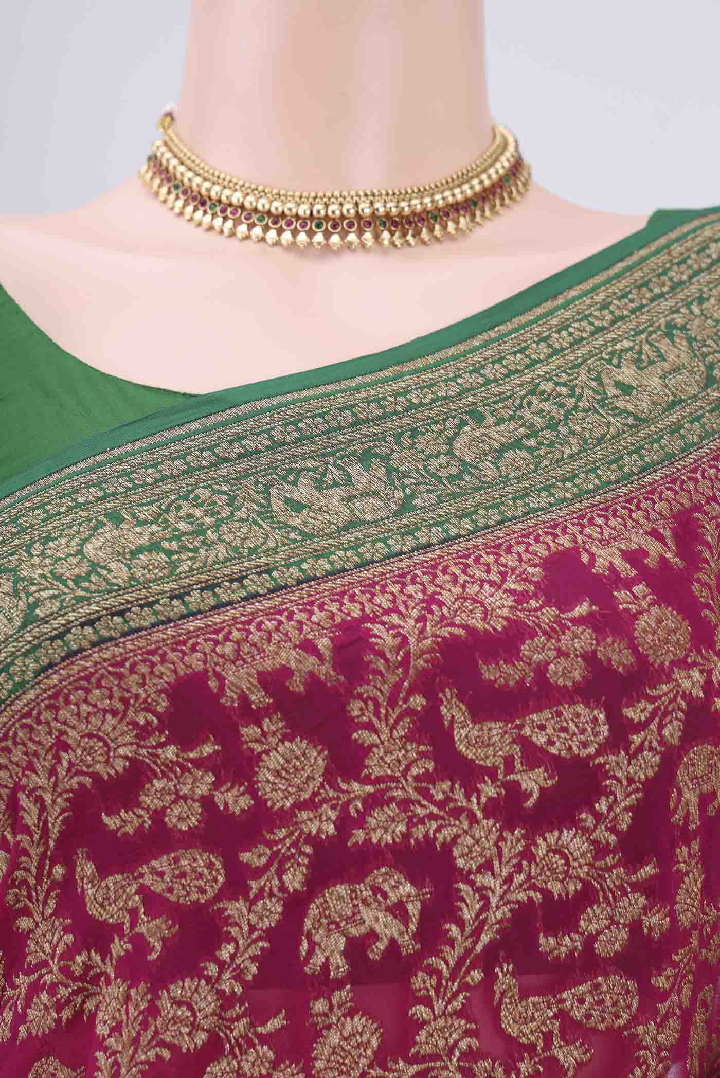 Border image of Rani Pink Banarasi Georgette Saree with Zari Brocade on the body and Zari Border. 