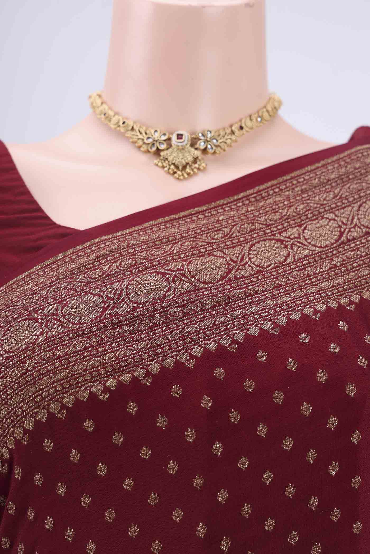 Border image of Maroon Banarasi Georgette Saree with Zari Butta on the body and Zari Border. 