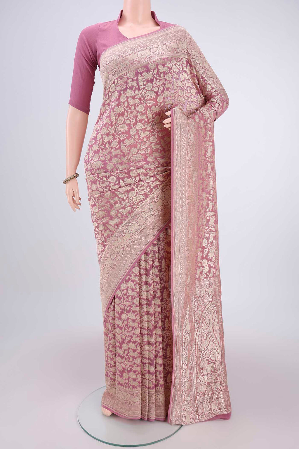 Rose pink Banarasi Georgette Saree with Zari Brocade on the body and Zari Border.  displayed on a mannequin