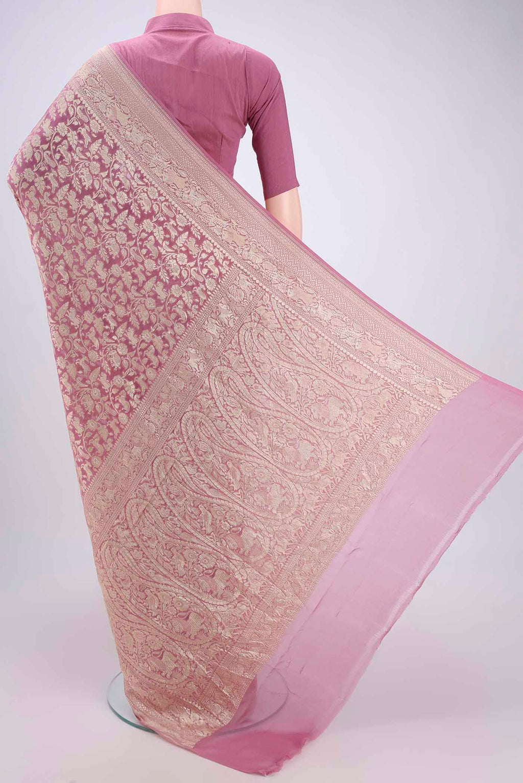 Flat view of Rose pink Banarasi Georgette Saree with Zari Brocade on the body and Zari Border. 