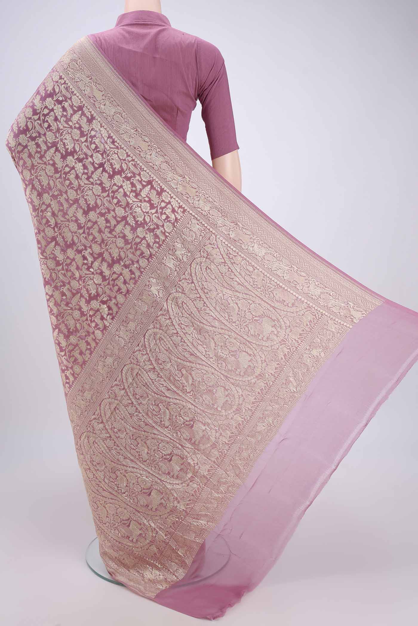 Flat view of Rose pink Banarasi Georgette Saree with Zari Brocade on the body and Zari Border. 