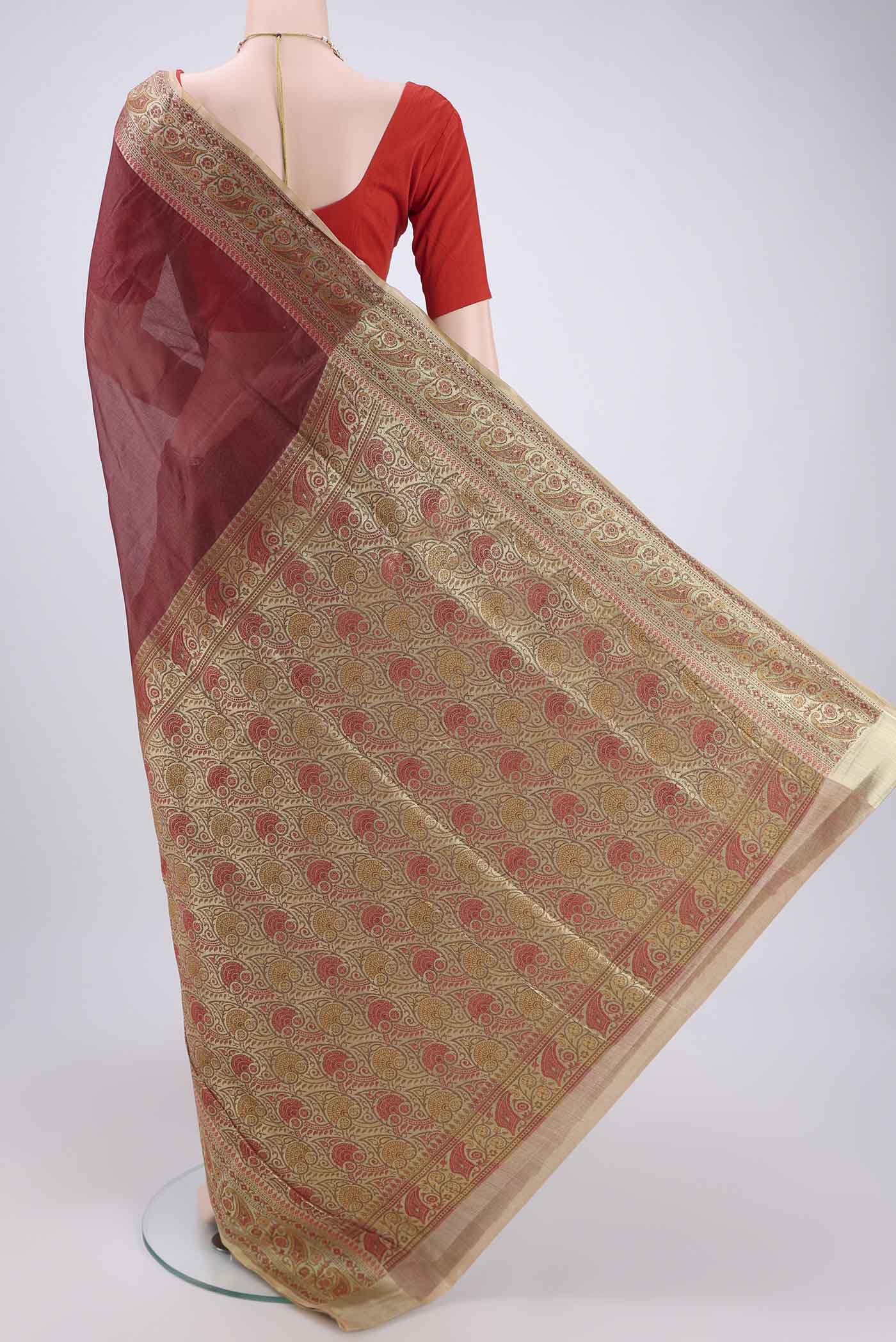 Flat view of Brown Banarasi Tussar Silk Saree with Zari Butta on the body and Zari And Thread Border. 