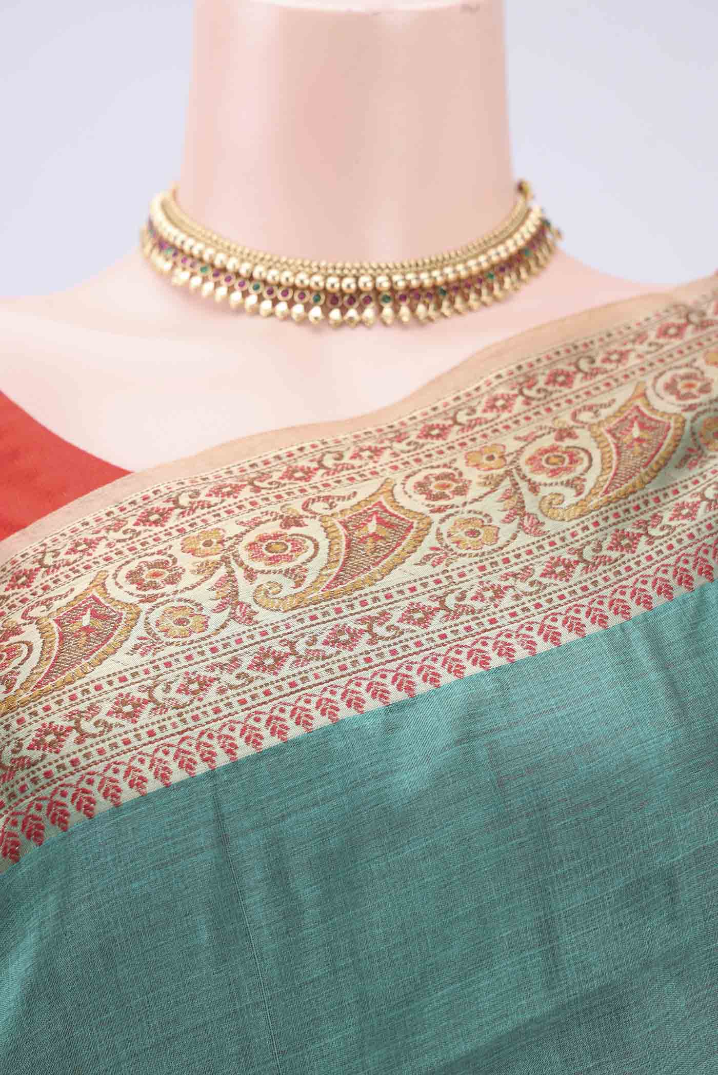 Border image of Green Banarasi Tussar Silk Saree with Zari Butta on the body and Zari And Thread Border. 