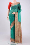 Green Banarasi Tussar Silk Saree with Zari Butta on the body and Zari And Thread Border.  displayed on a mannequin
