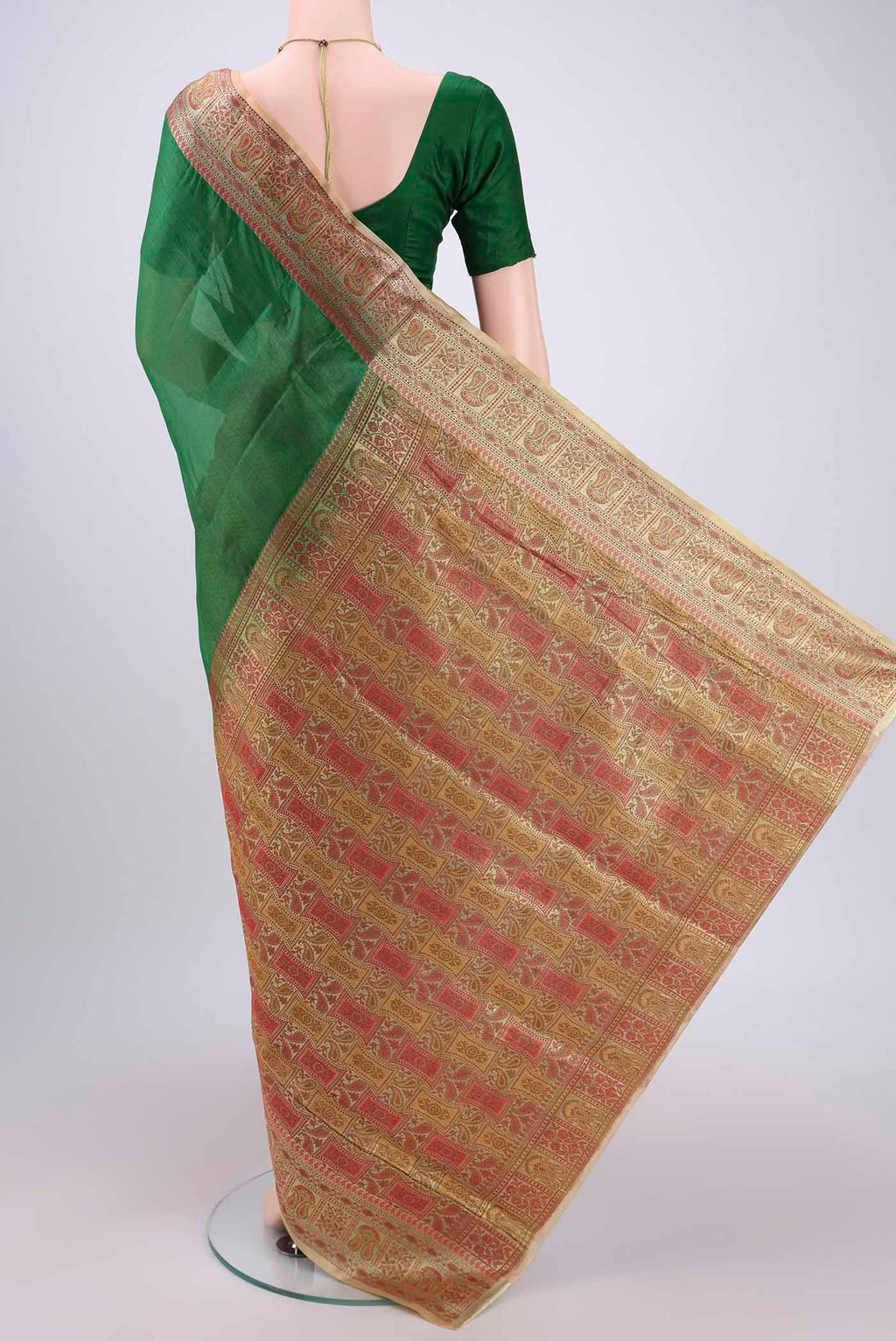 Flat view of Green Banarasi Tussar Silk Saree with Plain Body and Zari And Thread Border. 