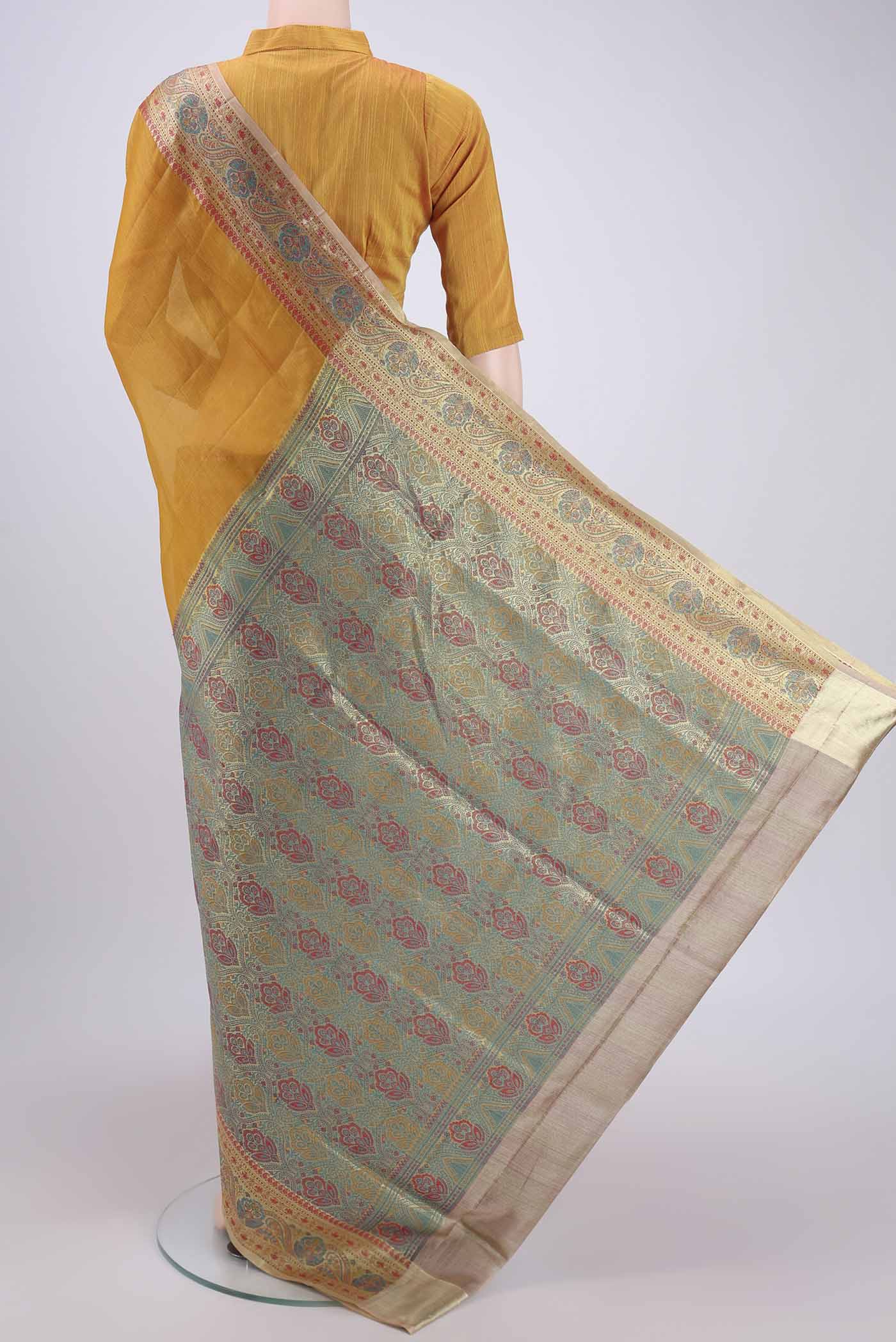 Flat view of Mustard Banarasi Tussar Silk Saree with Plain Body and Zari And Thread Border. 