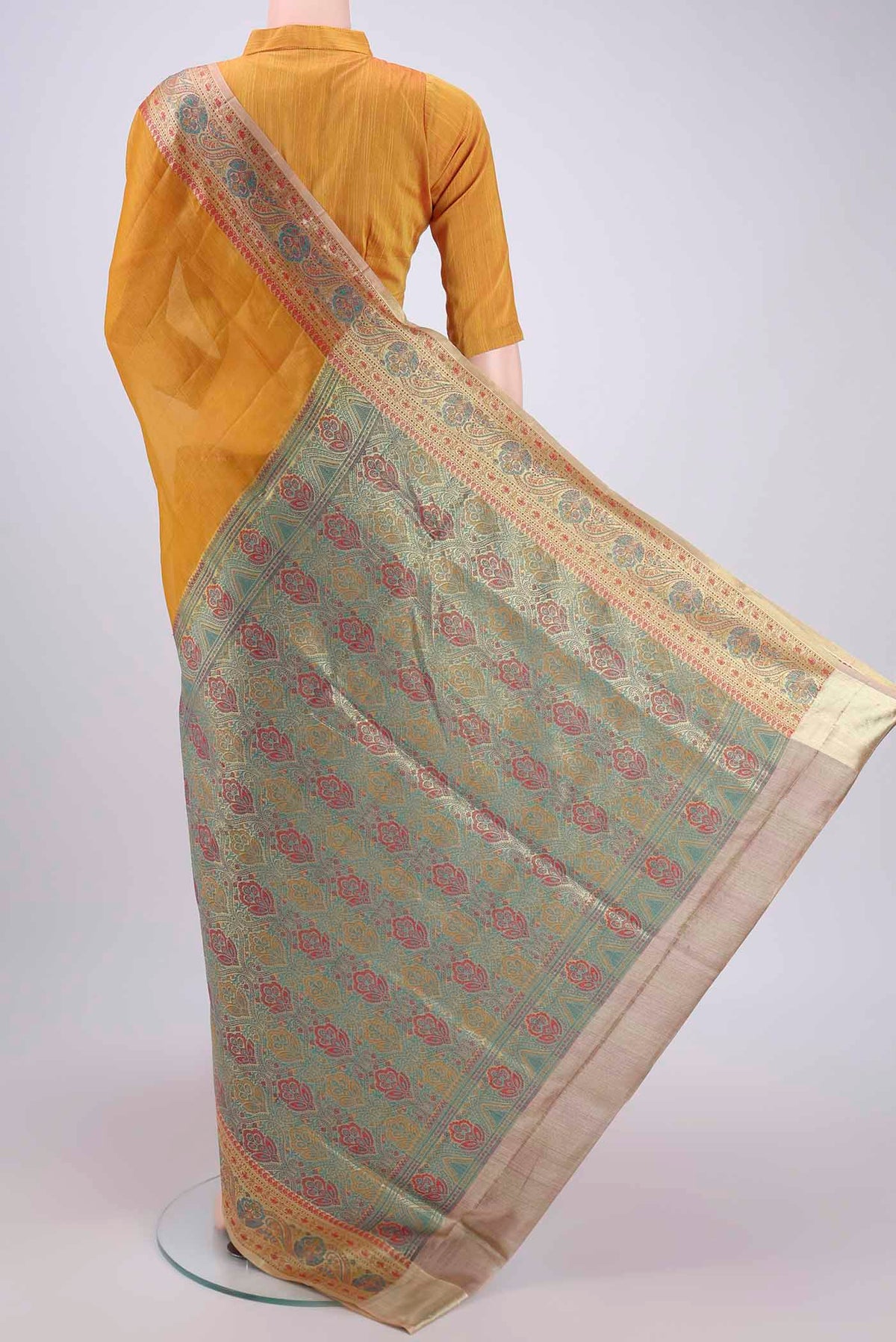 Flat view of Mustard Banarasi Tussar Silk Saree with Plain Body and Zari And Thread Border. 