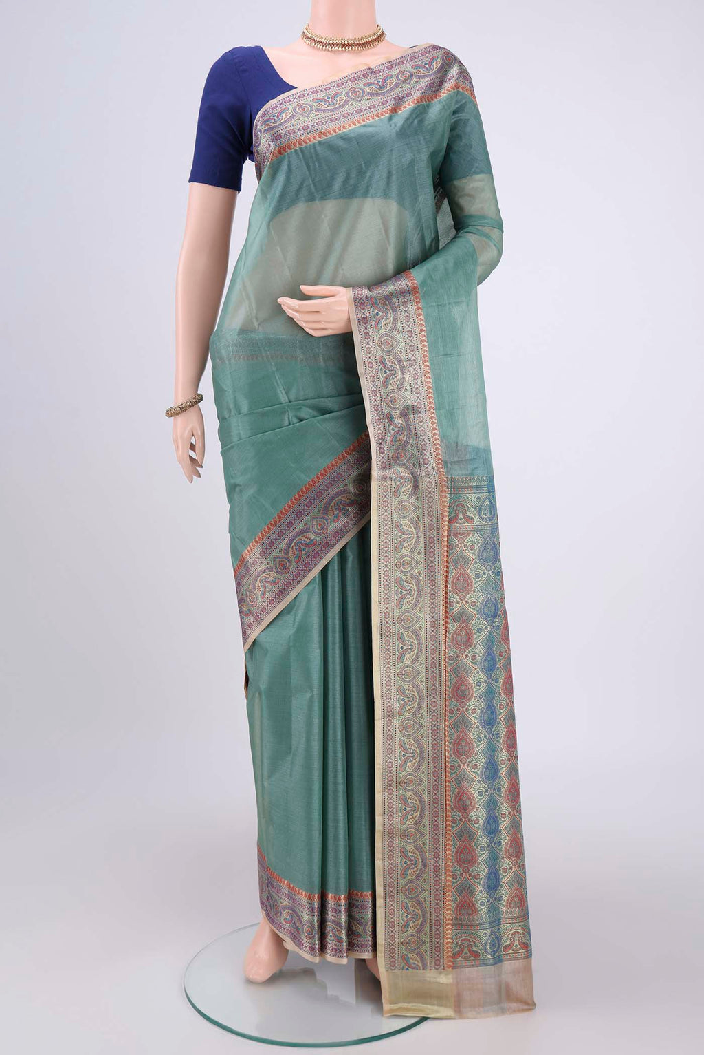 Sea Green Banarasi Tussar Silk Saree with Zari Butta on the body and Zari And Thread Border.  displayed on a mannequin