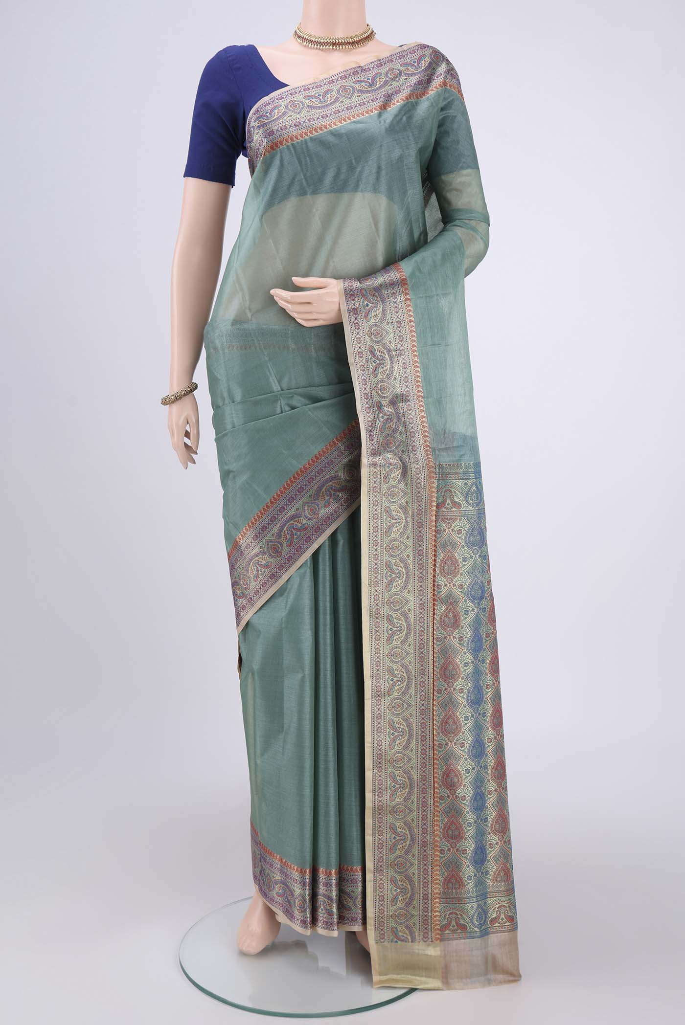 Sea Green Banarasi Tussar Silk Saree with Zari Butta on the body and Zari And Thread Border.  displayed on a mannequin