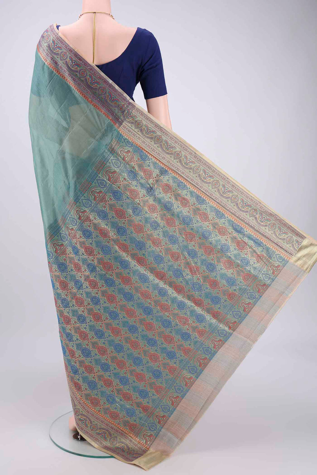 Flat view of Sea Green Banarasi Tussar Silk Saree with Zari Butta on the body and Zari And Thread Border. 