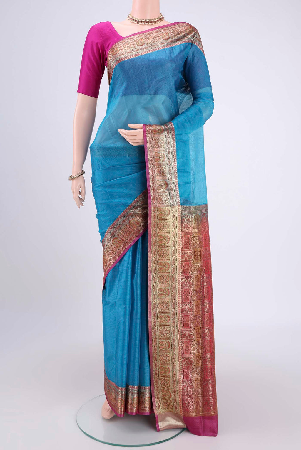 Blue Banarasi Tussar Silk Saree with Zari Butta on the body and Zari And Thread Border.  displayed on a mannequin