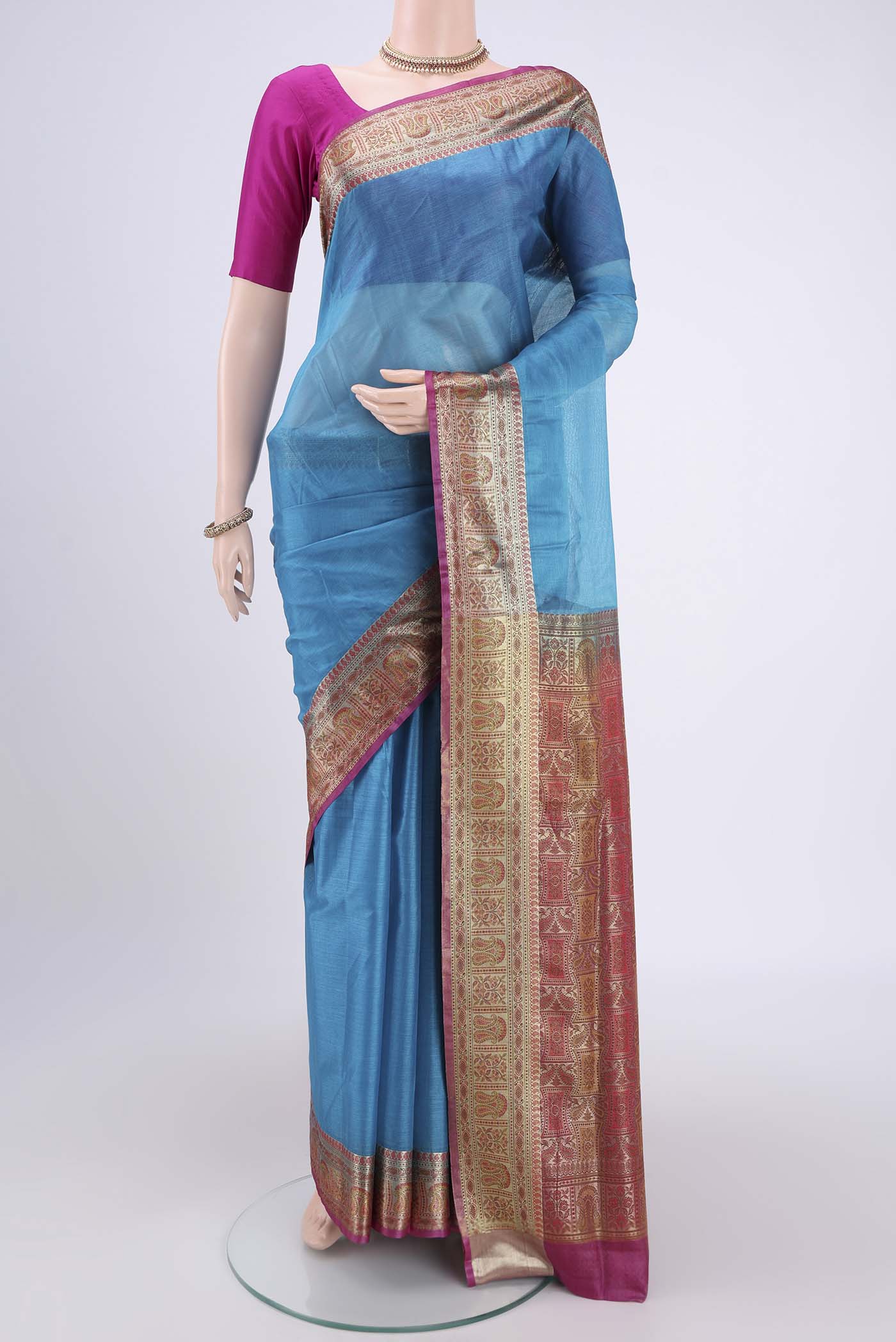Blue Banarasi Tussar Silk Saree with Zari Butta on the body and Zari And Thread Border.  displayed on a mannequin