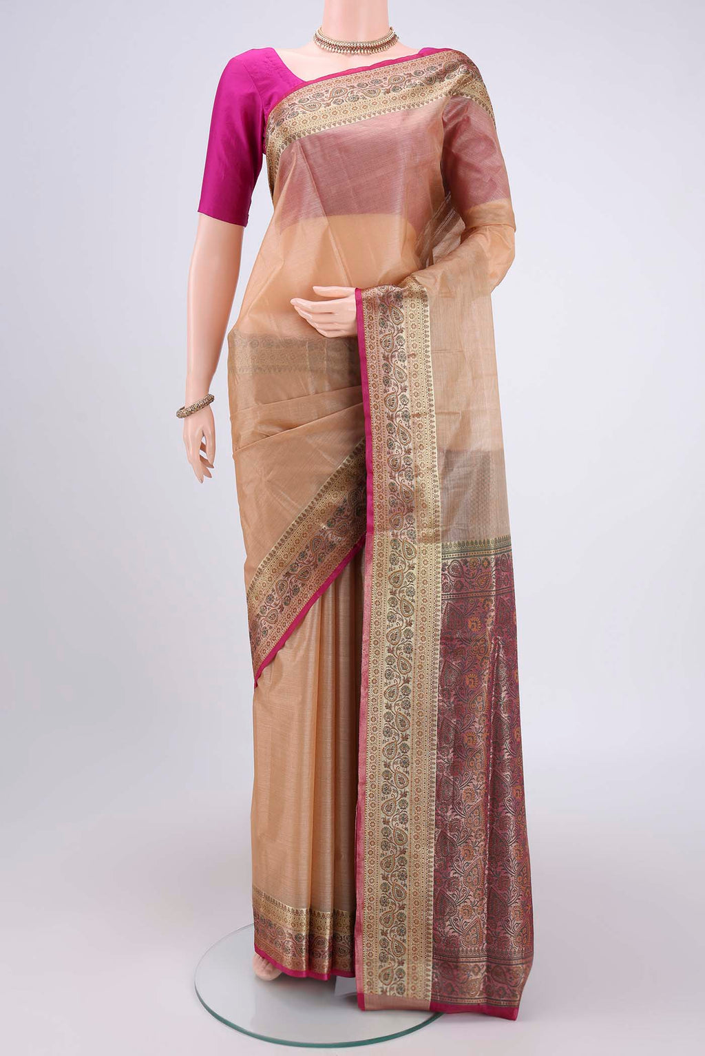 Beige Banarasi Tussar Silk Saree with Zari Butta on the body and Zari And Thread Border.  displayed on a mannequin