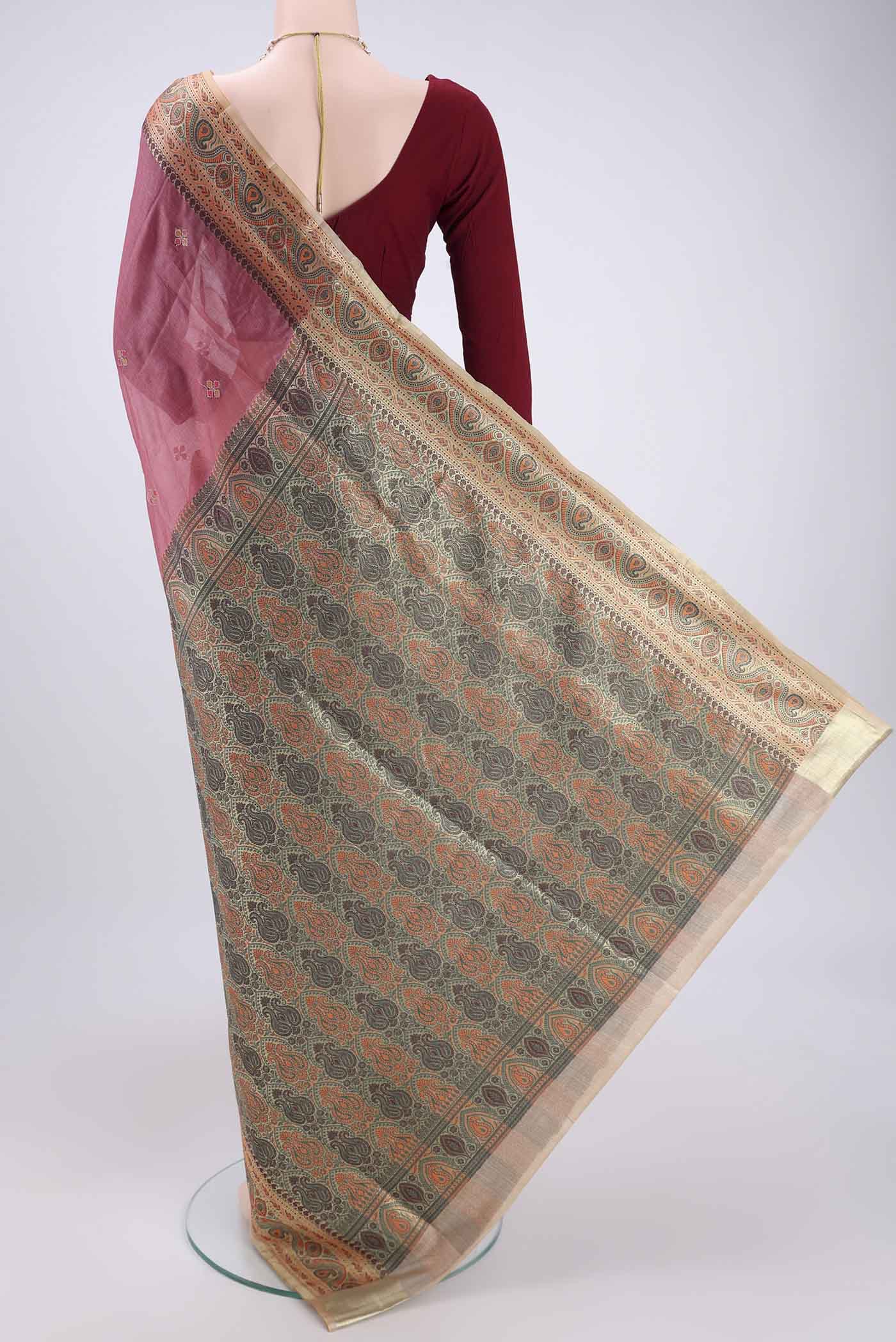 Flat view of Rose pink Banarasi Tussar Silk Saree with Zari Butta on the body and Zari And Thread Border. 