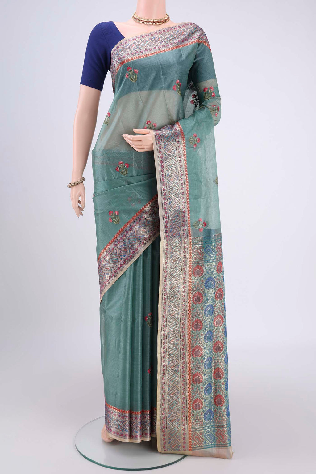 Sea Green Banarasi Tussar Silk Saree with Zari Butta on the body and Zari And Thread Border.  displayed on a mannequin