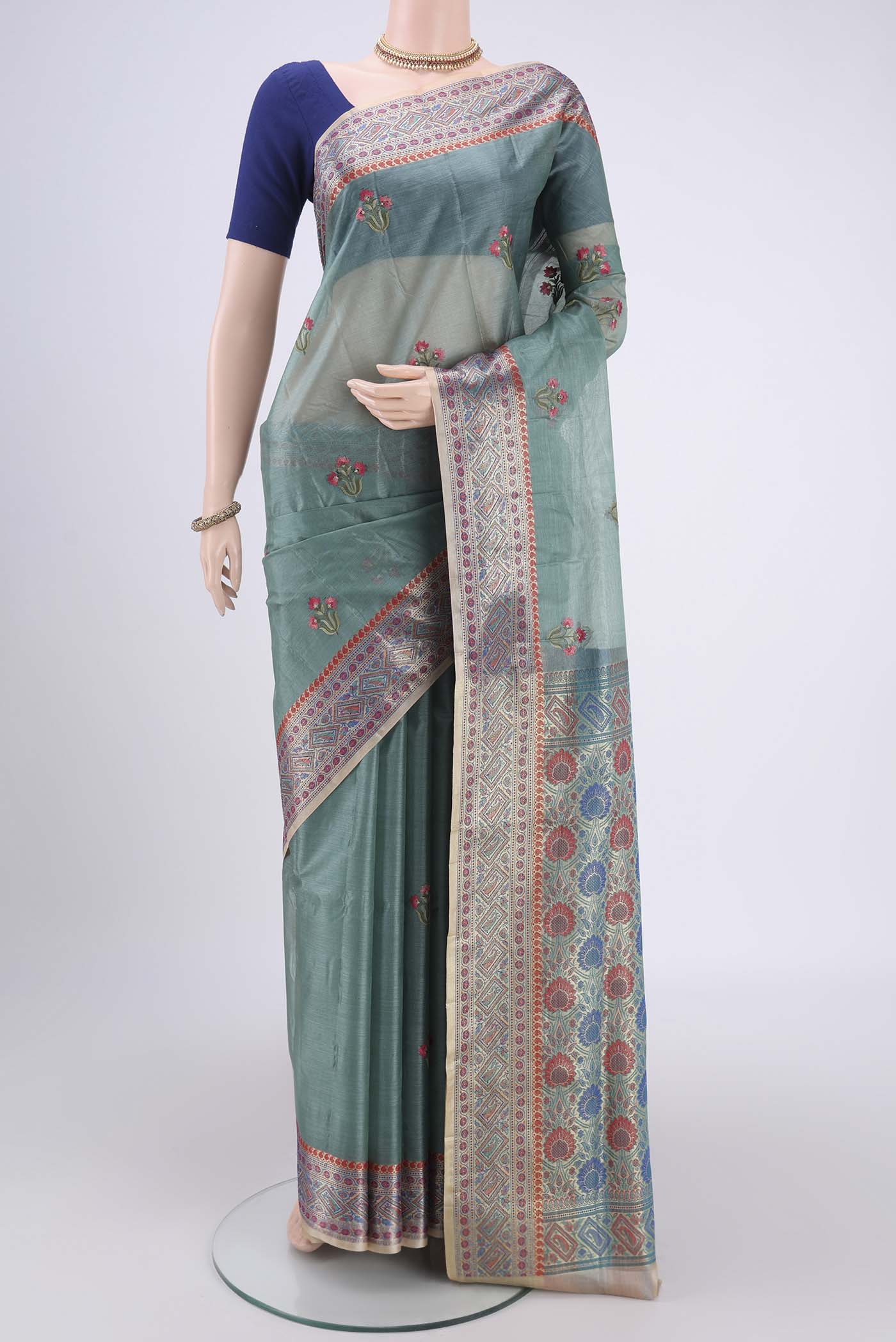 Sea Green Banarasi Tussar Silk Saree with Zari Butta on the body and Zari And Thread Border.  displayed on a mannequin