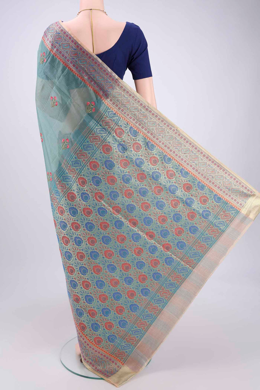 Flat view of Sea Green Banarasi Tussar Silk Saree with Zari Butta on the body and Zari And Thread Border. 