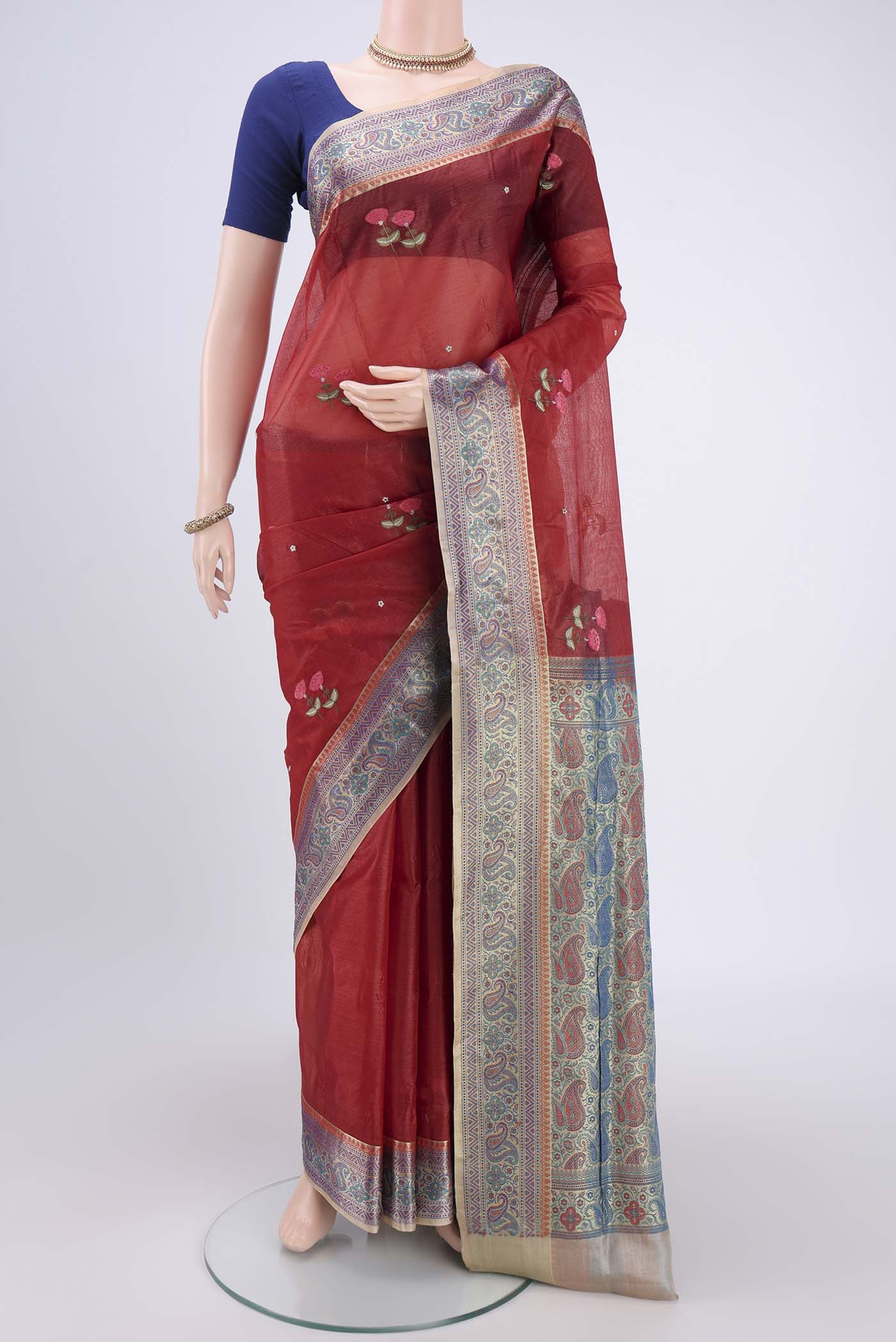 Brick Orange Banarasi Tussar Silk Saree with Zari Butta on the body and Zari And Thread Border.  displayed on a mannequin