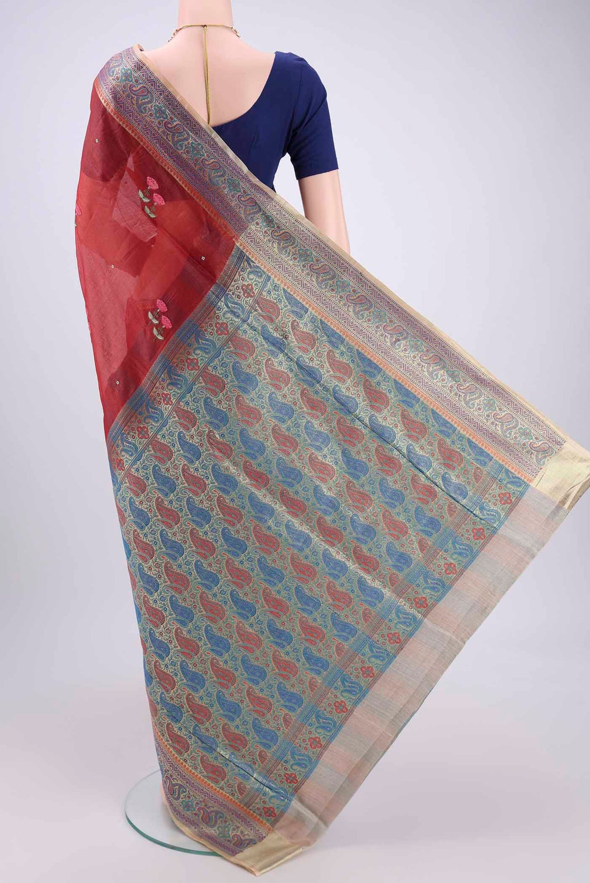 Flat view of Brick Orange Banarasi Tussar Silk Saree with Zari Butta on the body and Zari And Thread Border. 