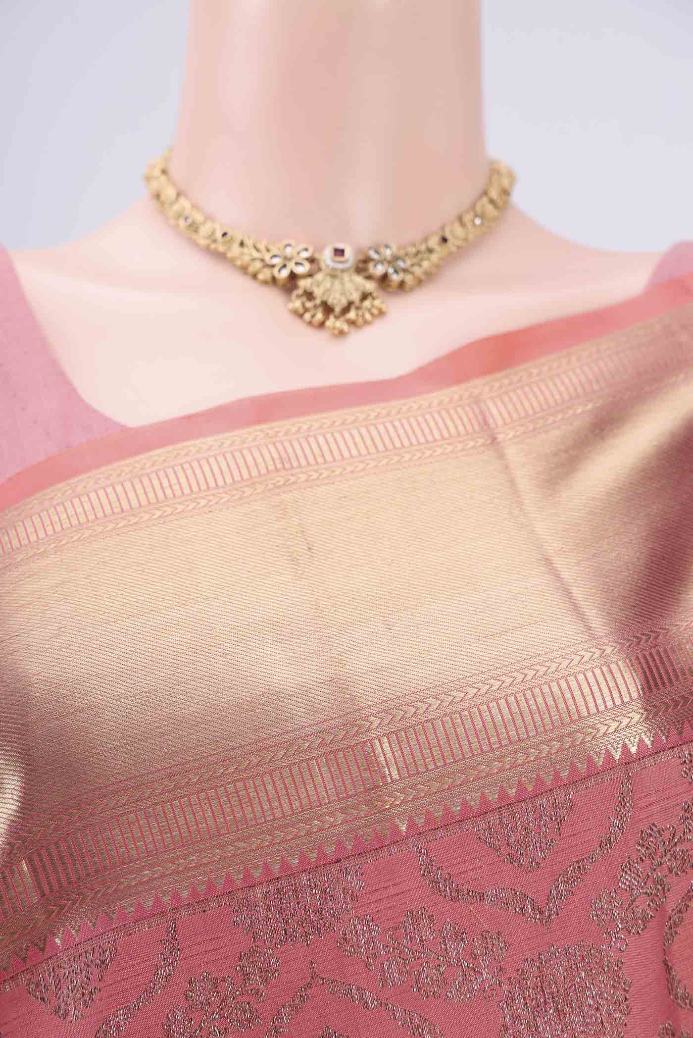 Border image of Peach Kanchipuram Silk Saree with Zari Brocade on the body and Zari Border. 