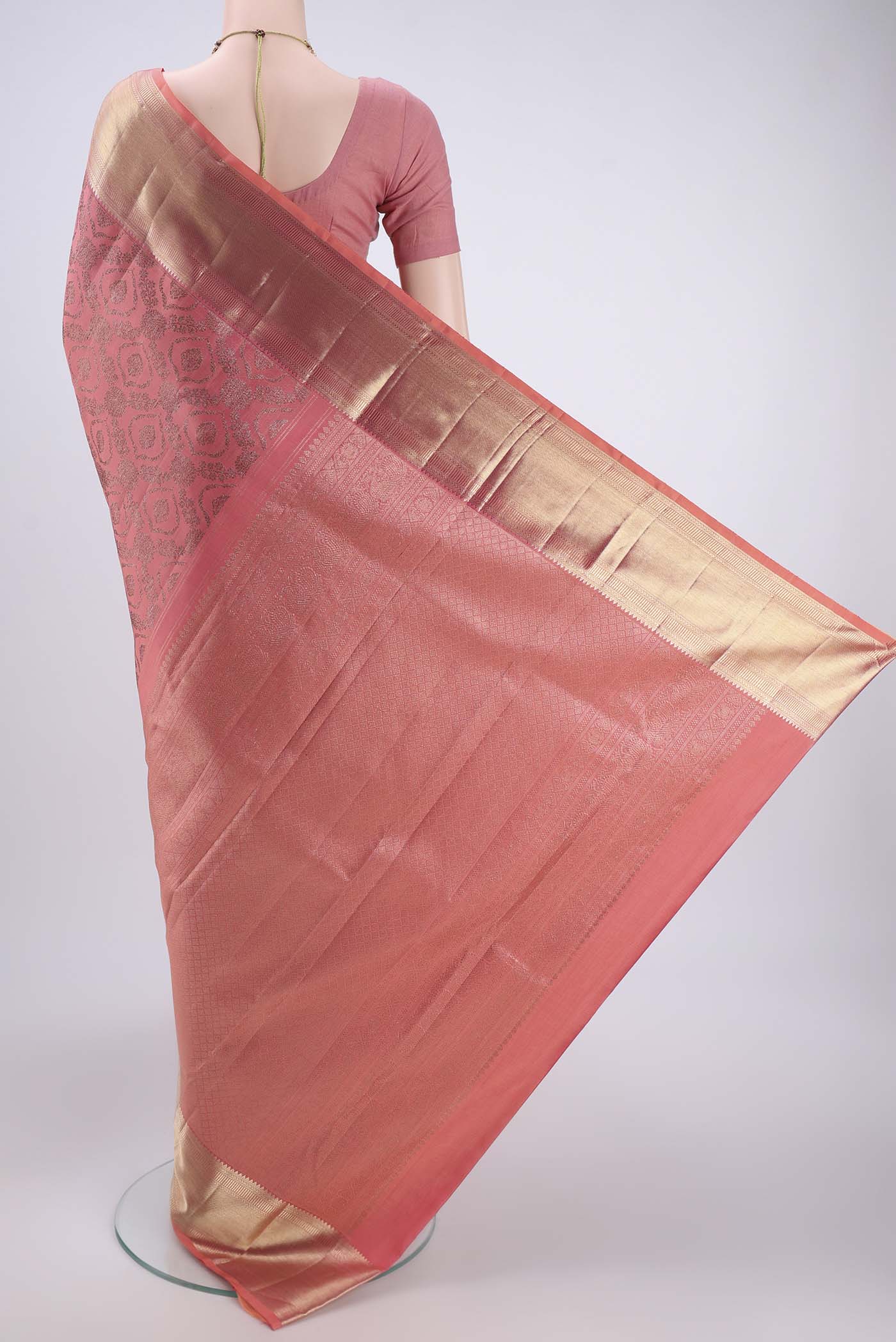 Flat view of Peach Kanchipuram Silk Saree with Zari Brocade on the body and Zari Border. 