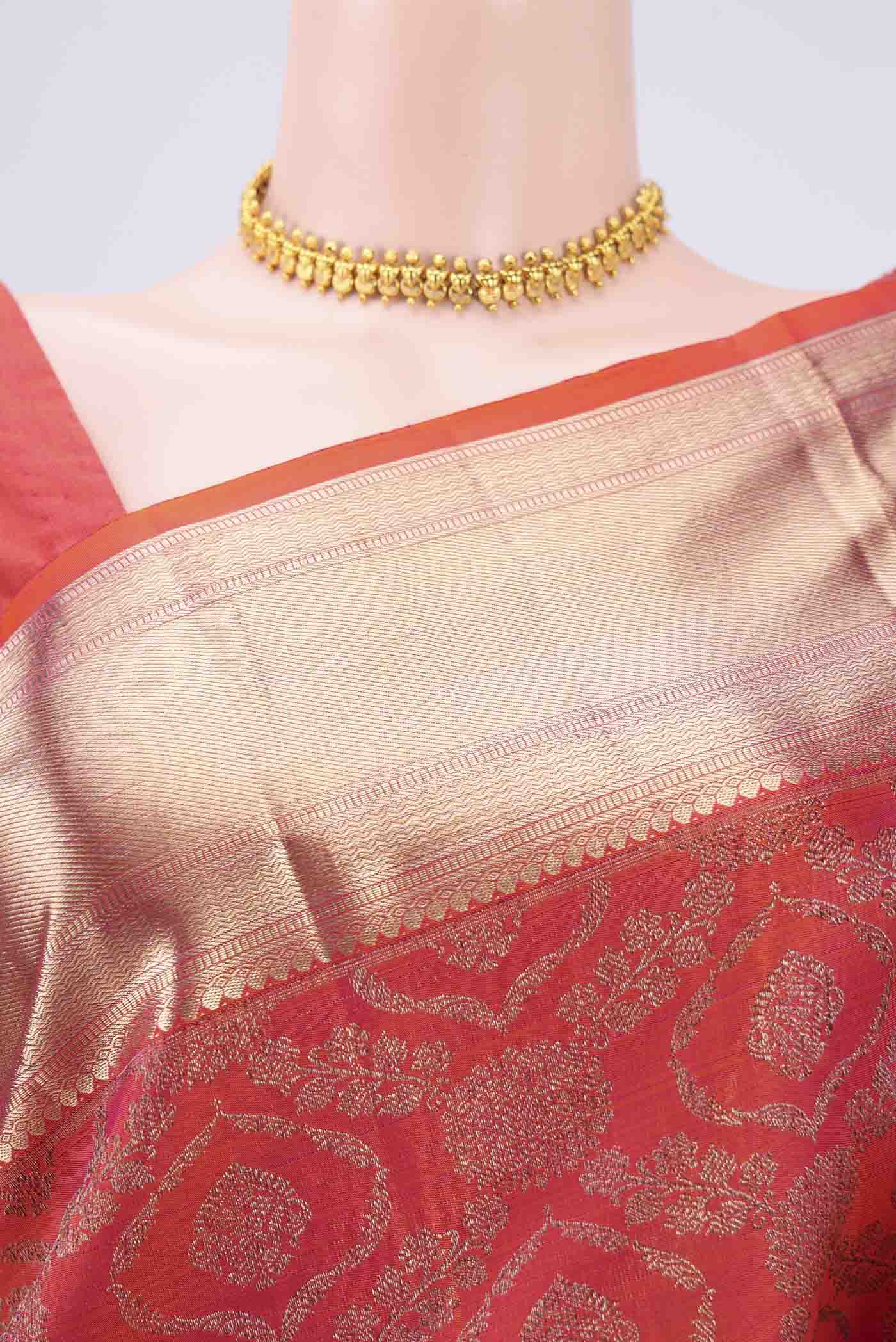 Border image of Orange Kanchipuram Silk Saree with Zari Butta on the body and Zari Border. 