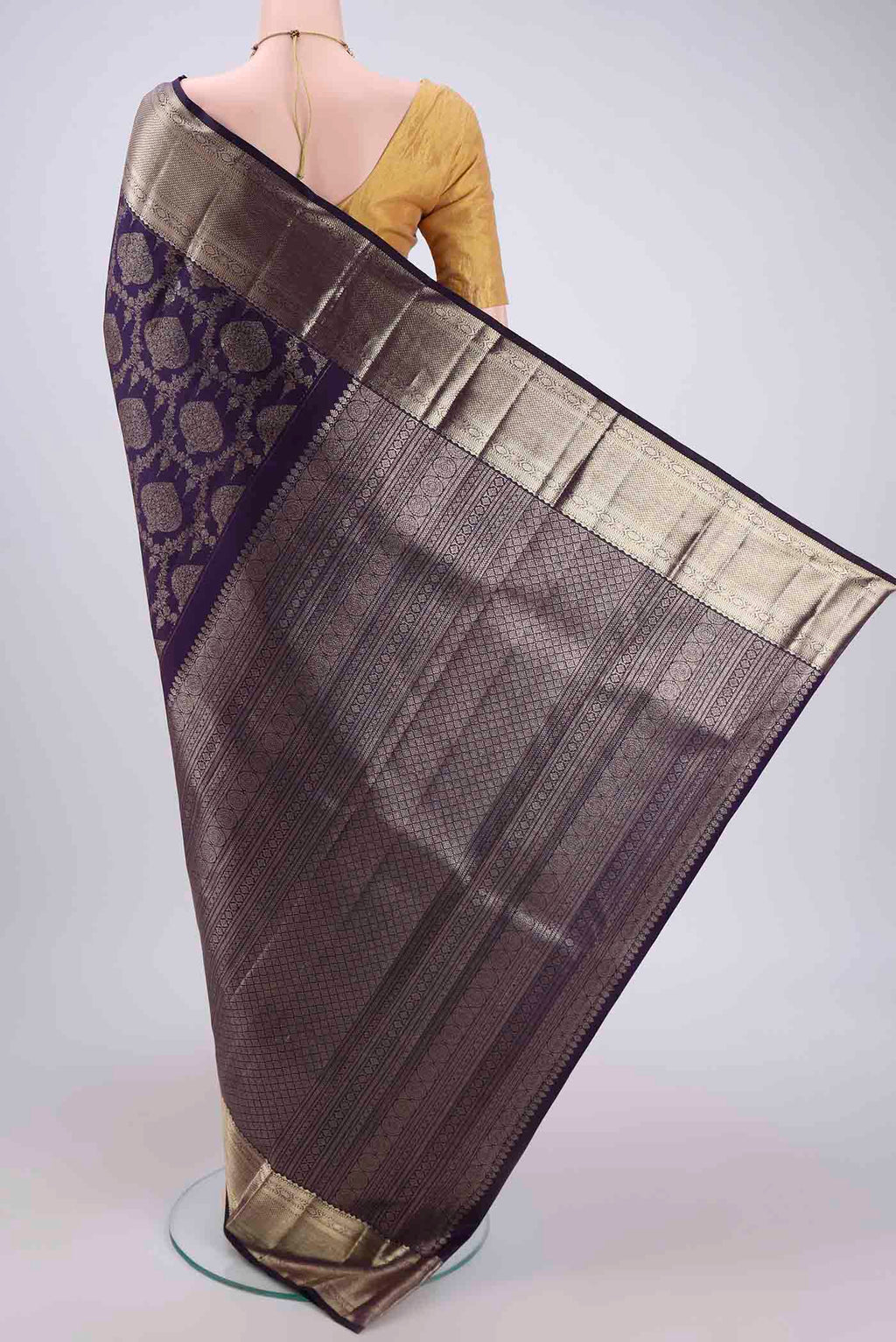 Flat view of Purple Kanchipuram Silk Saree with Zari Brocade on the body and Zari Border. 