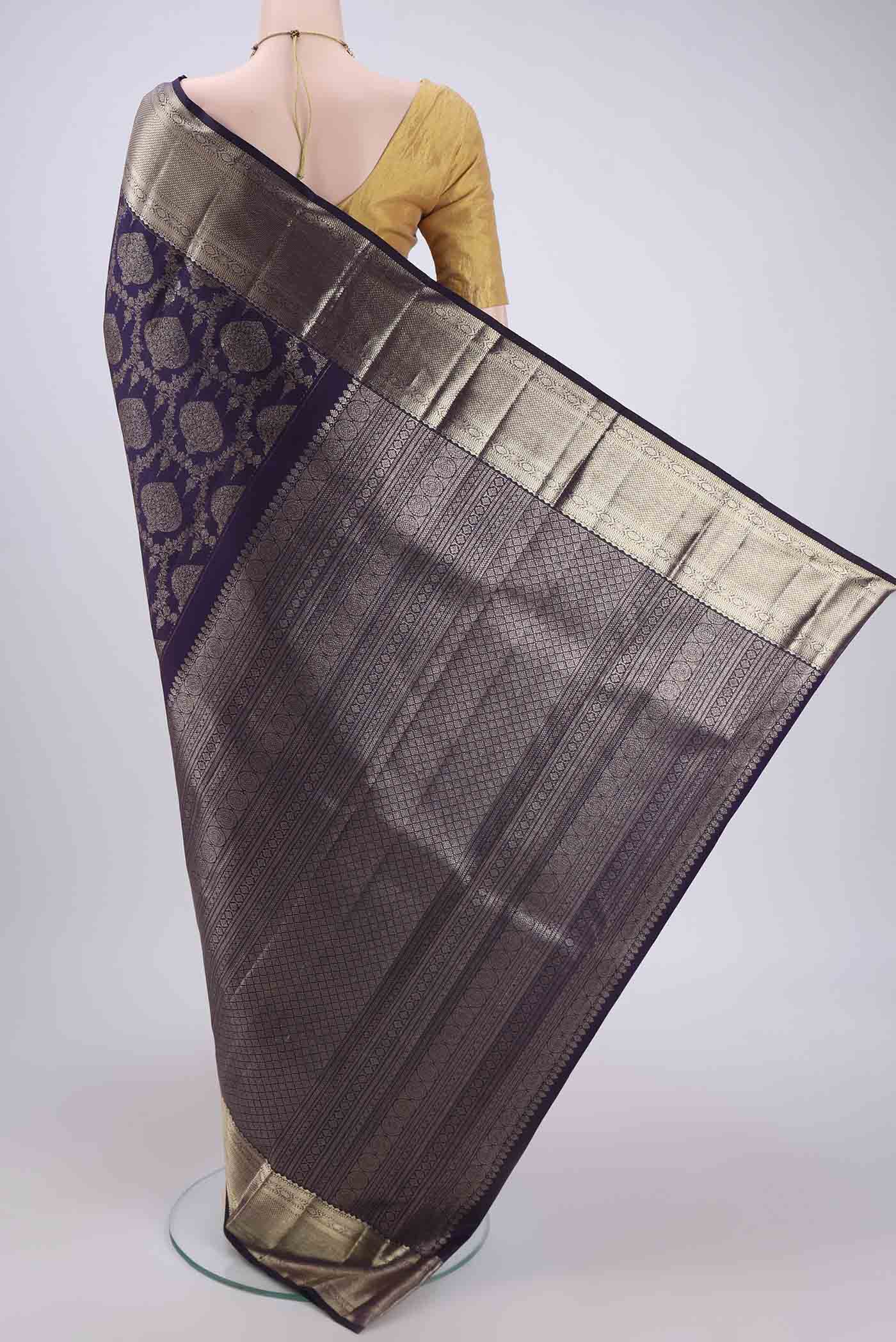 Flat view of Purple Kanchipuram Silk Saree with Zari Brocade on the body and Zari Border. 