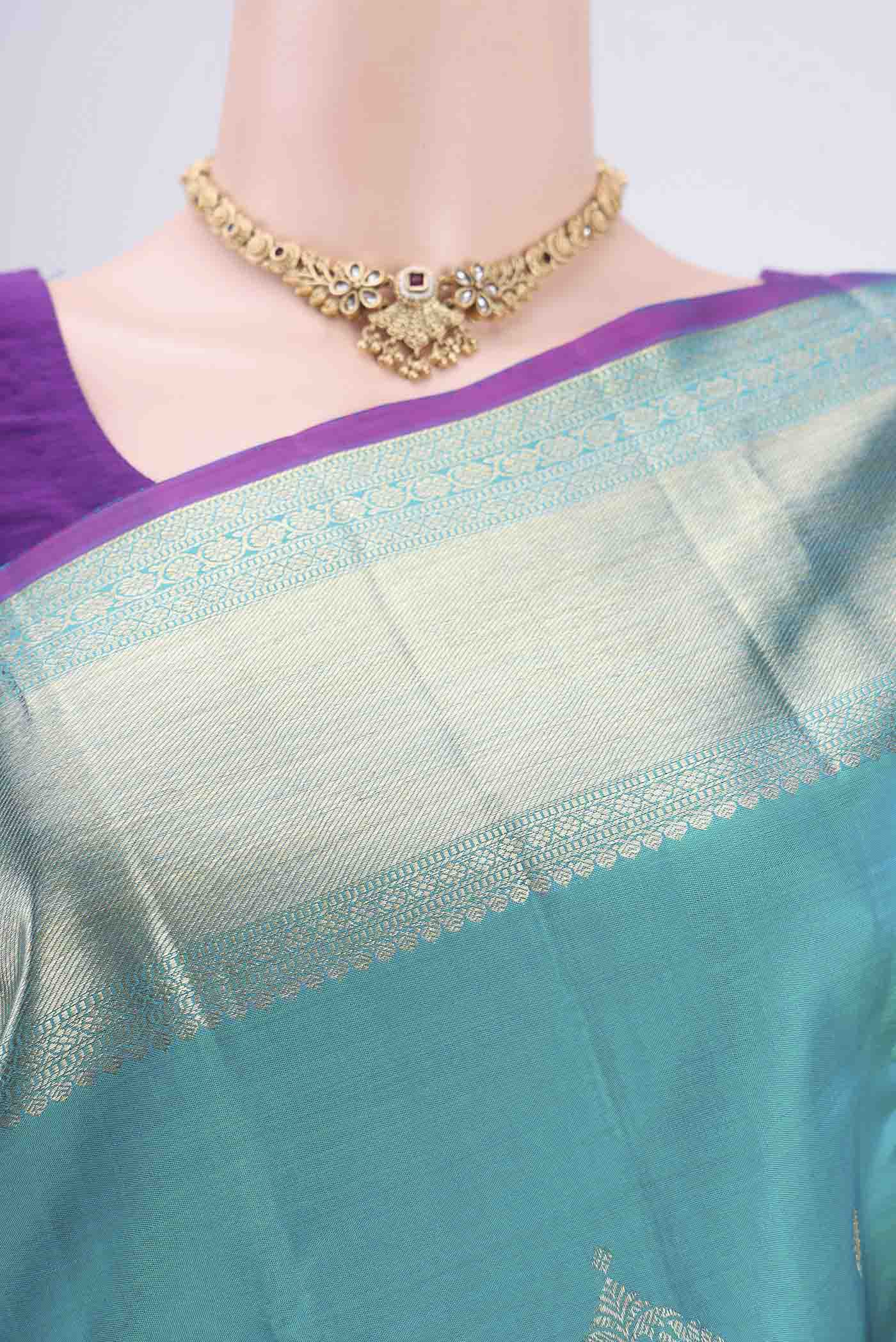 Border image of Blue Kanjivaram Silk Saree with Zari Butta on the body and Zari Border. 