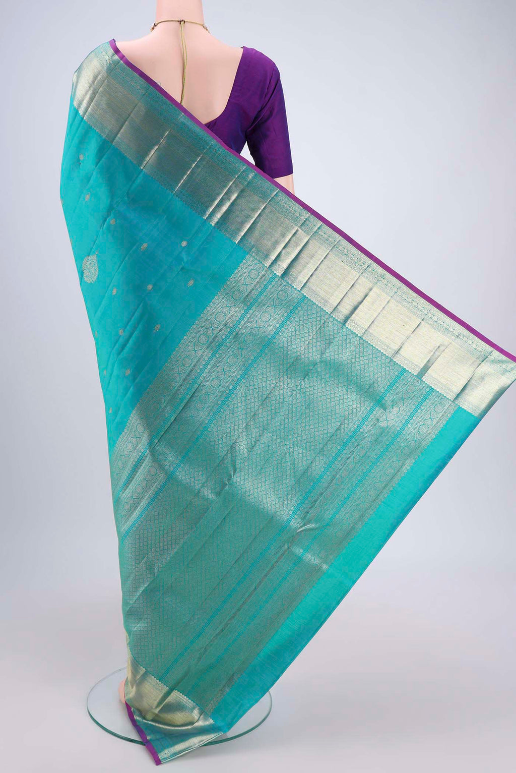 Flat view of Blue Kanjivaram Silk Saree with Zari Butta on the body and Zari Border. 