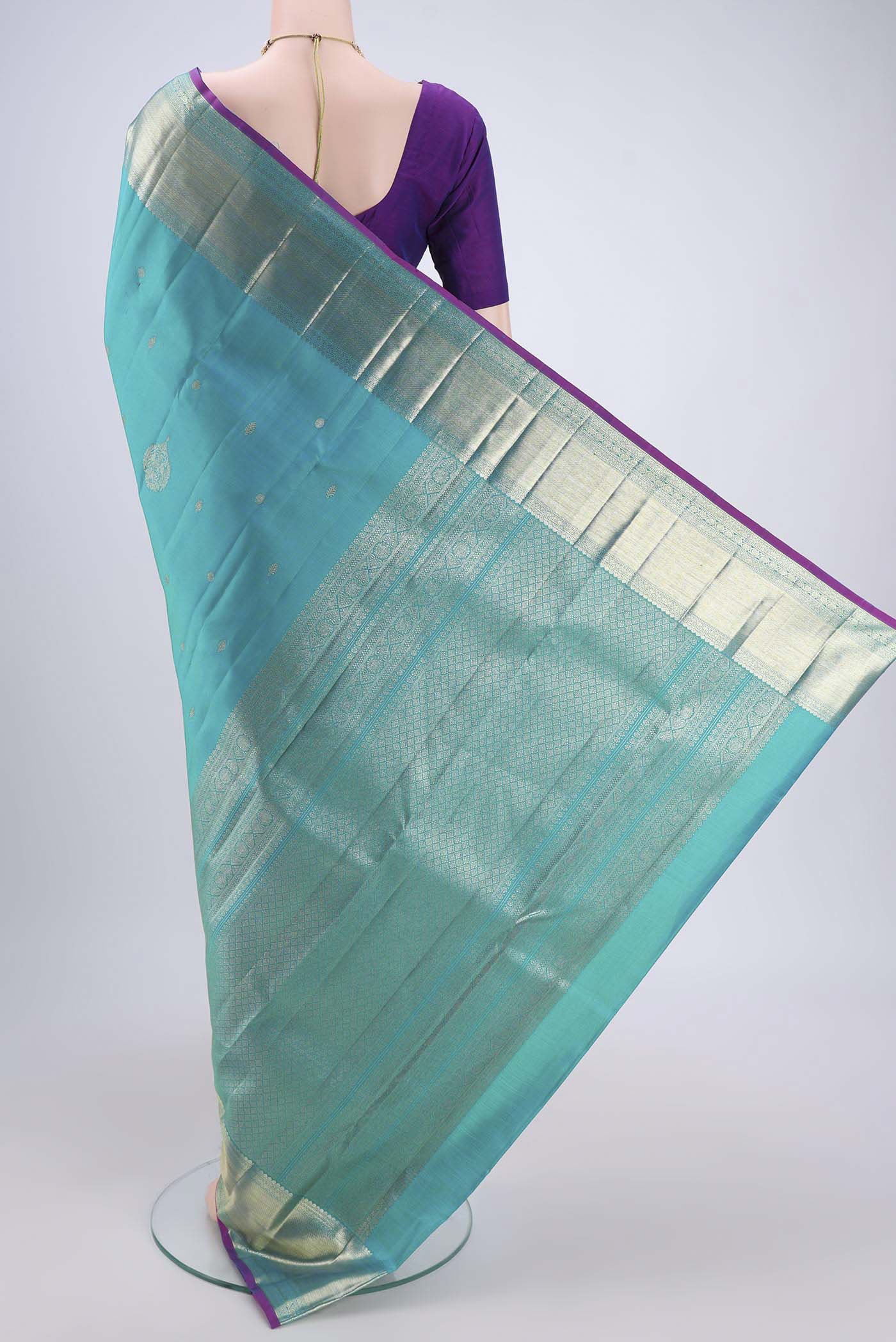 Flat view of Blue Kanjivaram Silk Saree with Zari Butta on the body and Zari Border. 