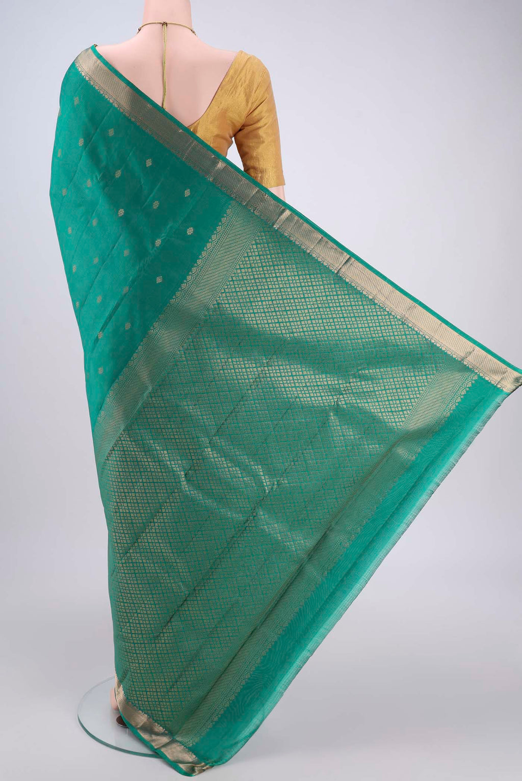 Flat view of Sea Green Kanjivaram Silk Saree with Zari Butta on the body and Zari Border. 