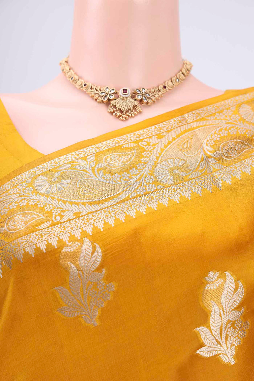 Border image of Mustard Banarasi Raw Silk Saree with Zari Butta on the body and Zari Border. 