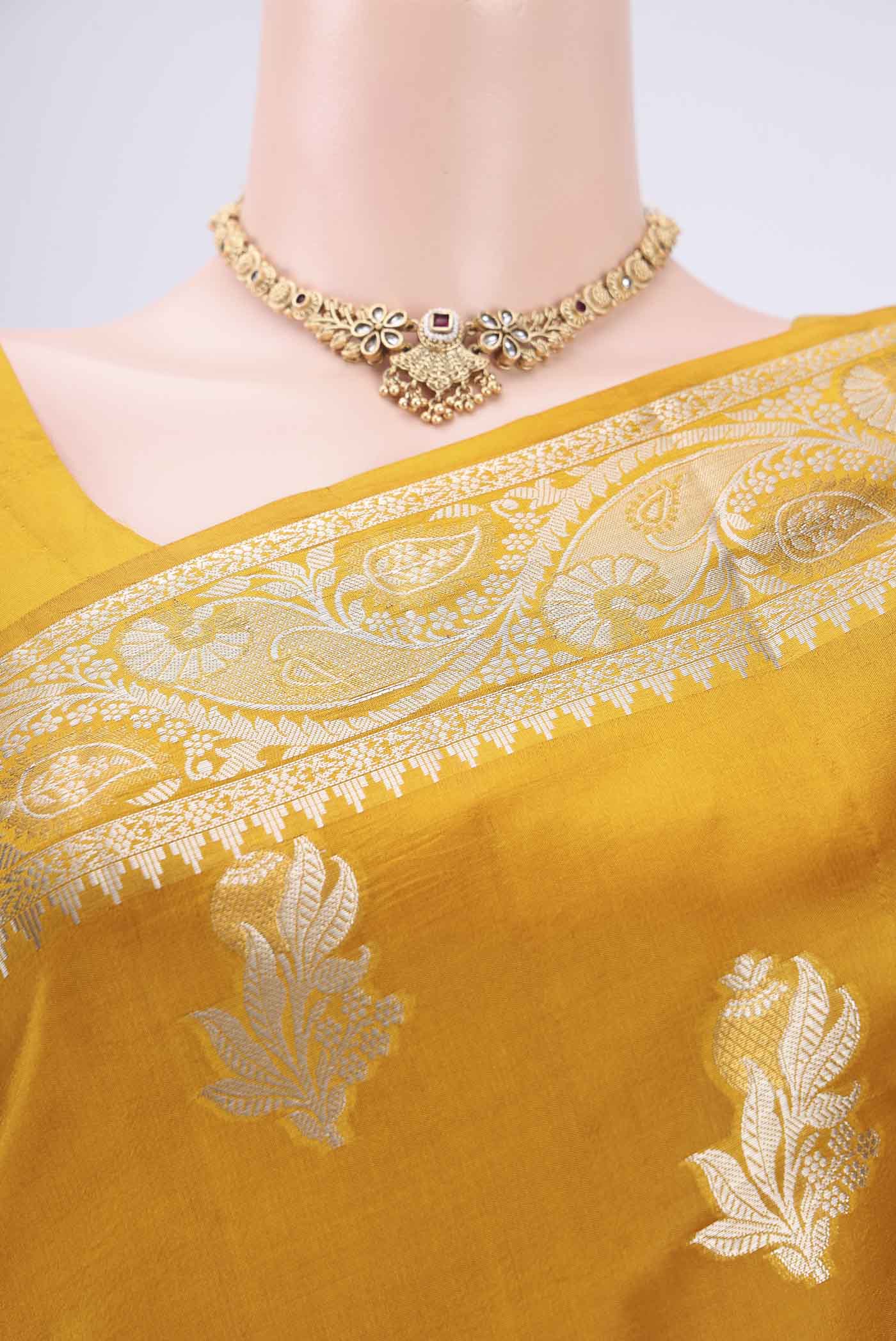 Border image of Mustard Banarasi Raw Silk Saree with Zari Butta on the body and Zari Border. 