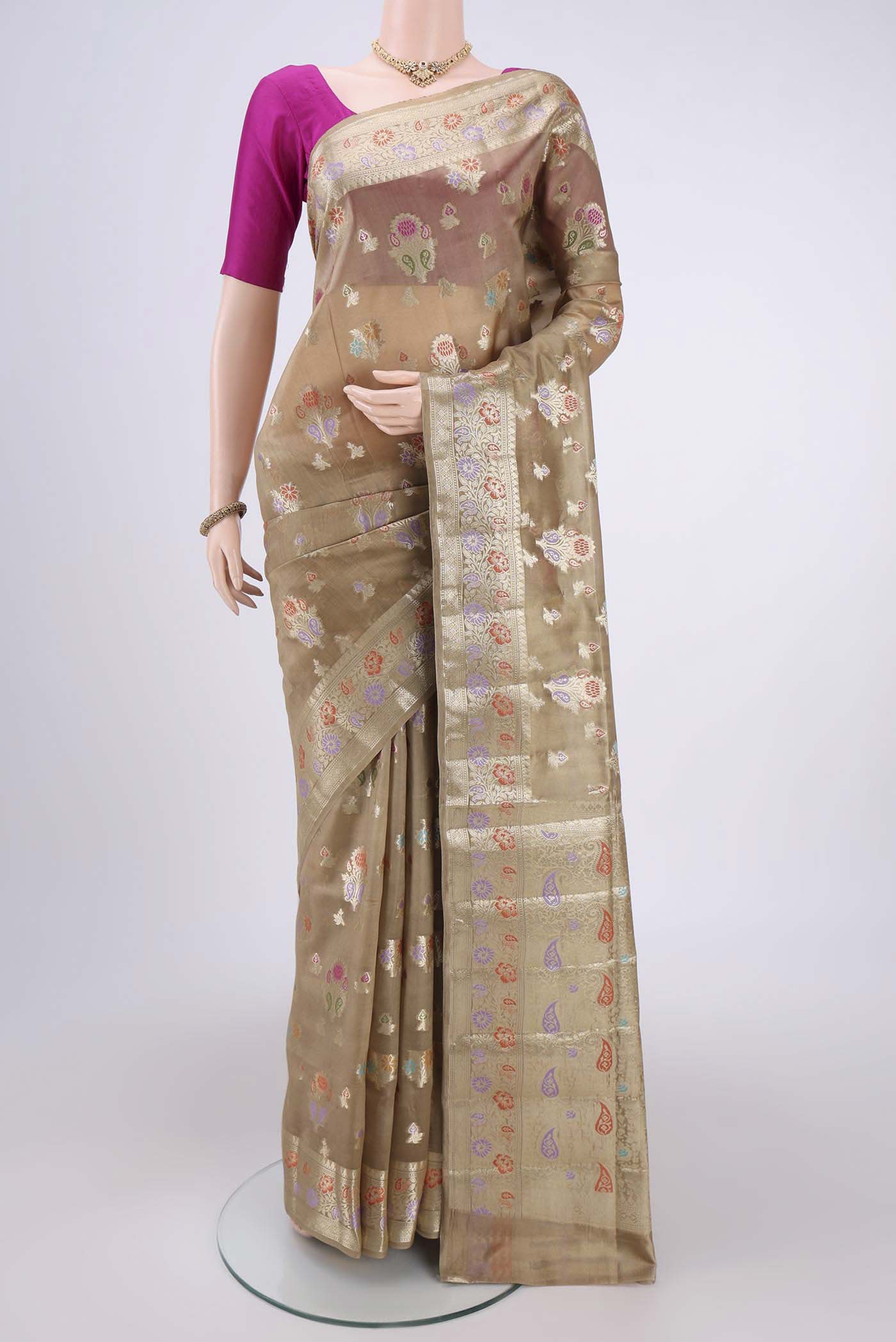 Dark Beige Banarasi Raw Silk Saree with Zari And Thread Butta on the body and Zari And Thread Border.  displayed on a mannequin