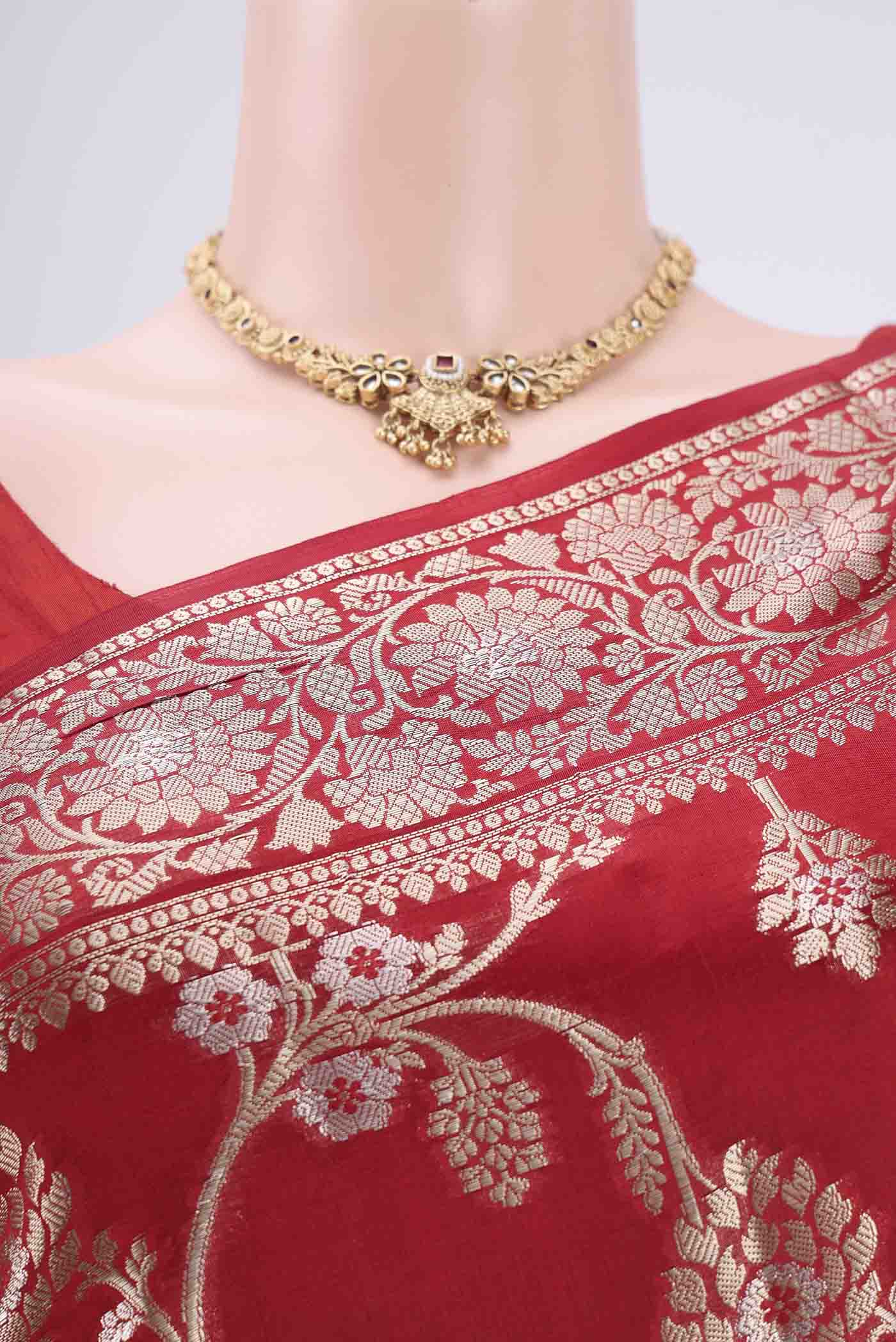 Border image of Maroon Banarasi Raw Silk Saree with Zari Butta on the body and Zari Border. 