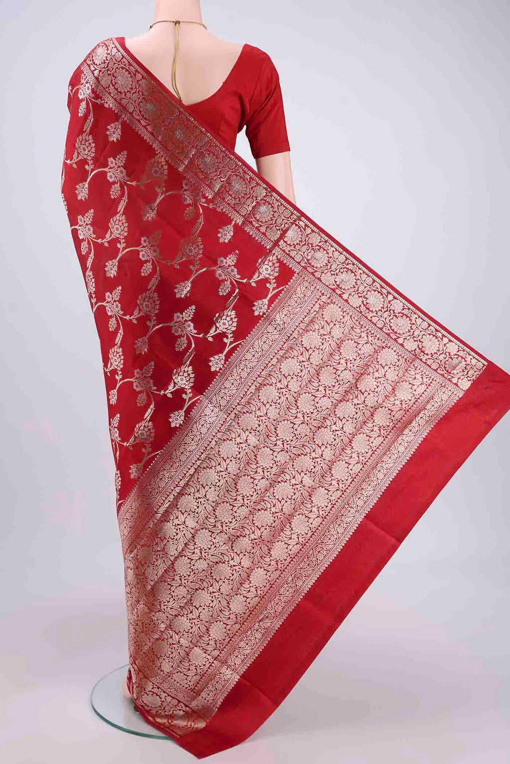 Flat view of Maroon Banarasi Raw Silk Saree with Zari Butta on the body and Zari Border. 