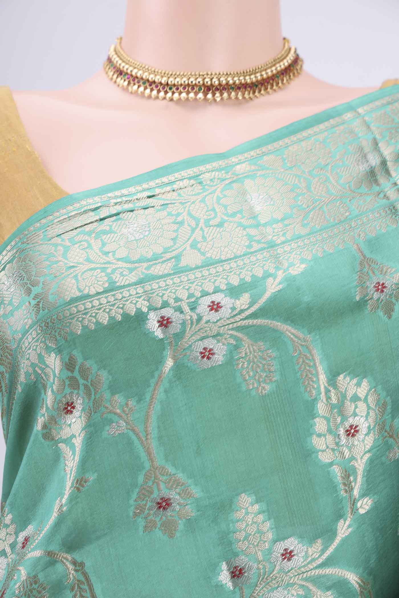 Border image of Sea Green Banarasi Raw Silk Saree with Zari Butta on the body and Zari Border. 