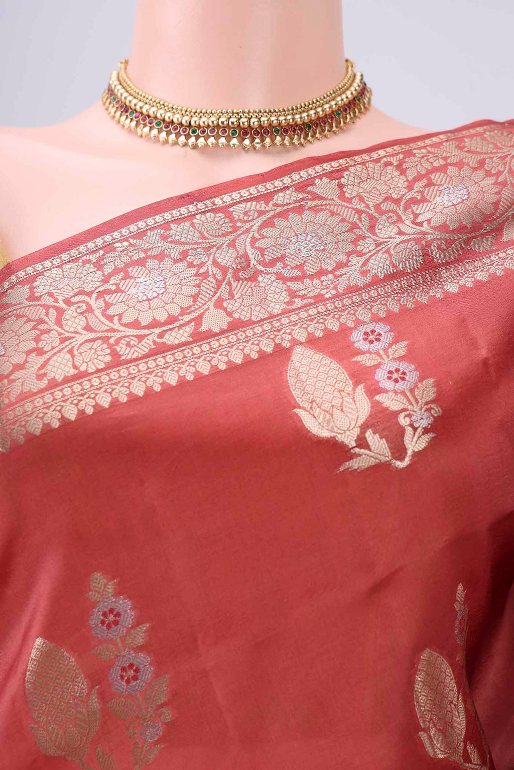 Border image of Rust Banarasi Raw Silk Saree with Zari Butta on the body and Zari Border. 
