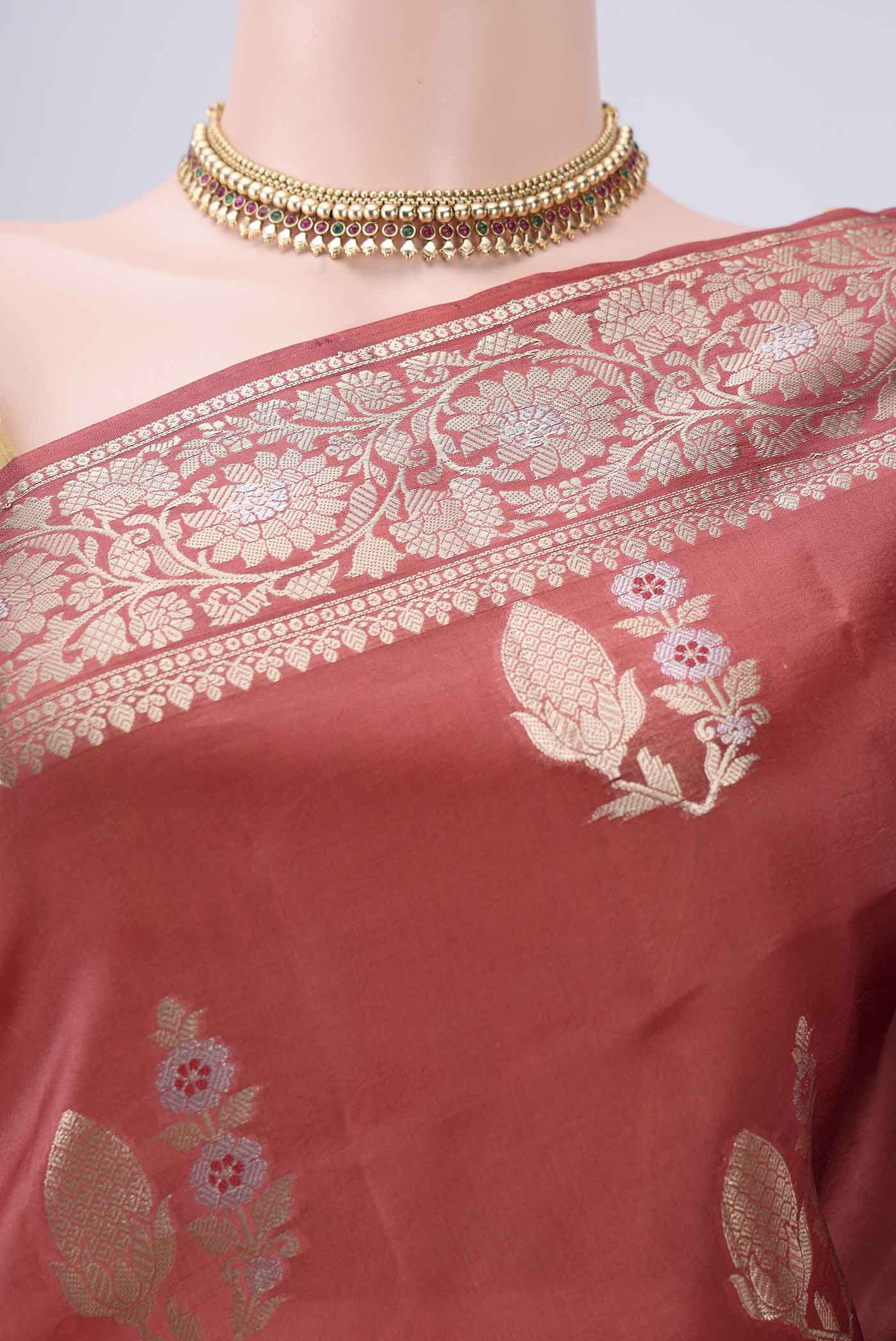 Border image of Rust Banarasi Raw Silk Saree with Zari Butta on the body and Zari Border. 