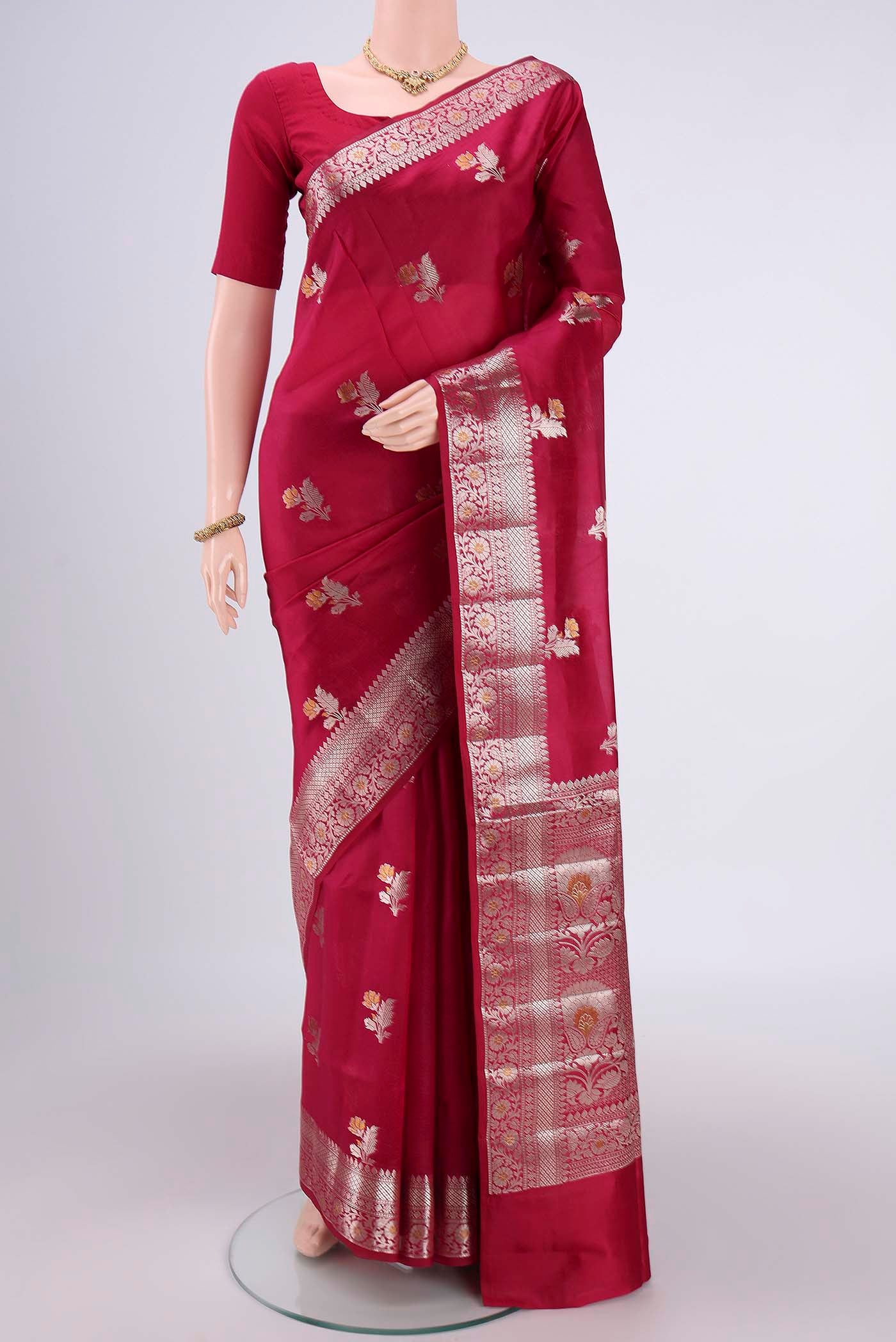Dark Pink Banarasi Raw Silk Saree with Zari Butta on the body and Zari Border.  displayed on a mannequin