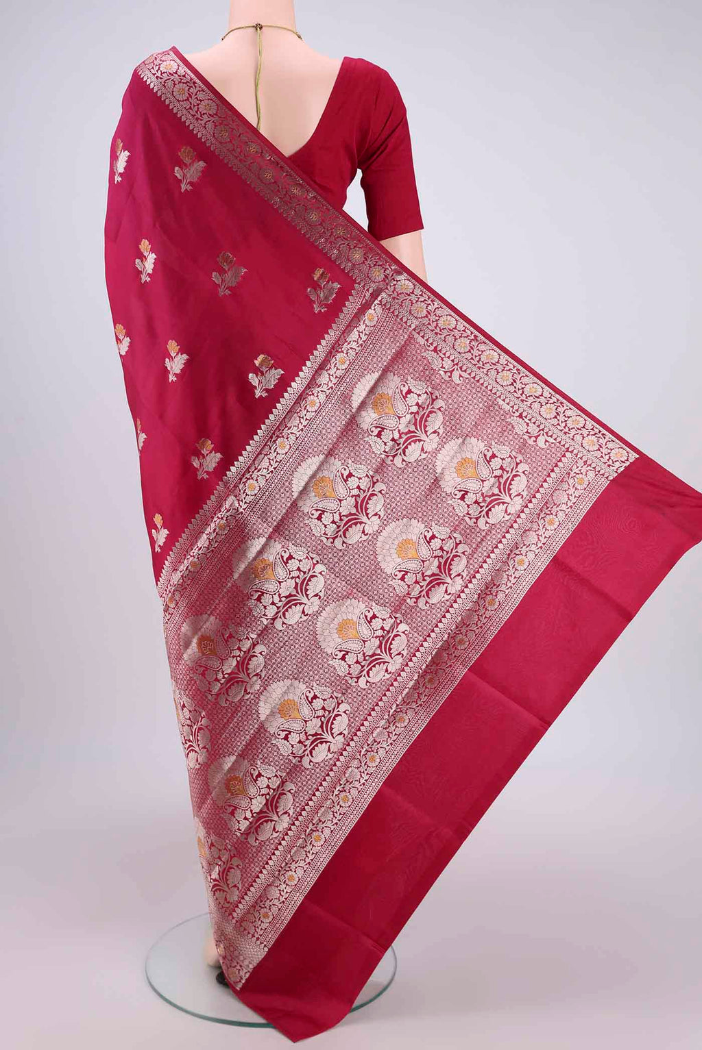 Flat view of Dark Pink Banarasi Raw Silk Saree with Zari Butta on the body and Zari Border. 