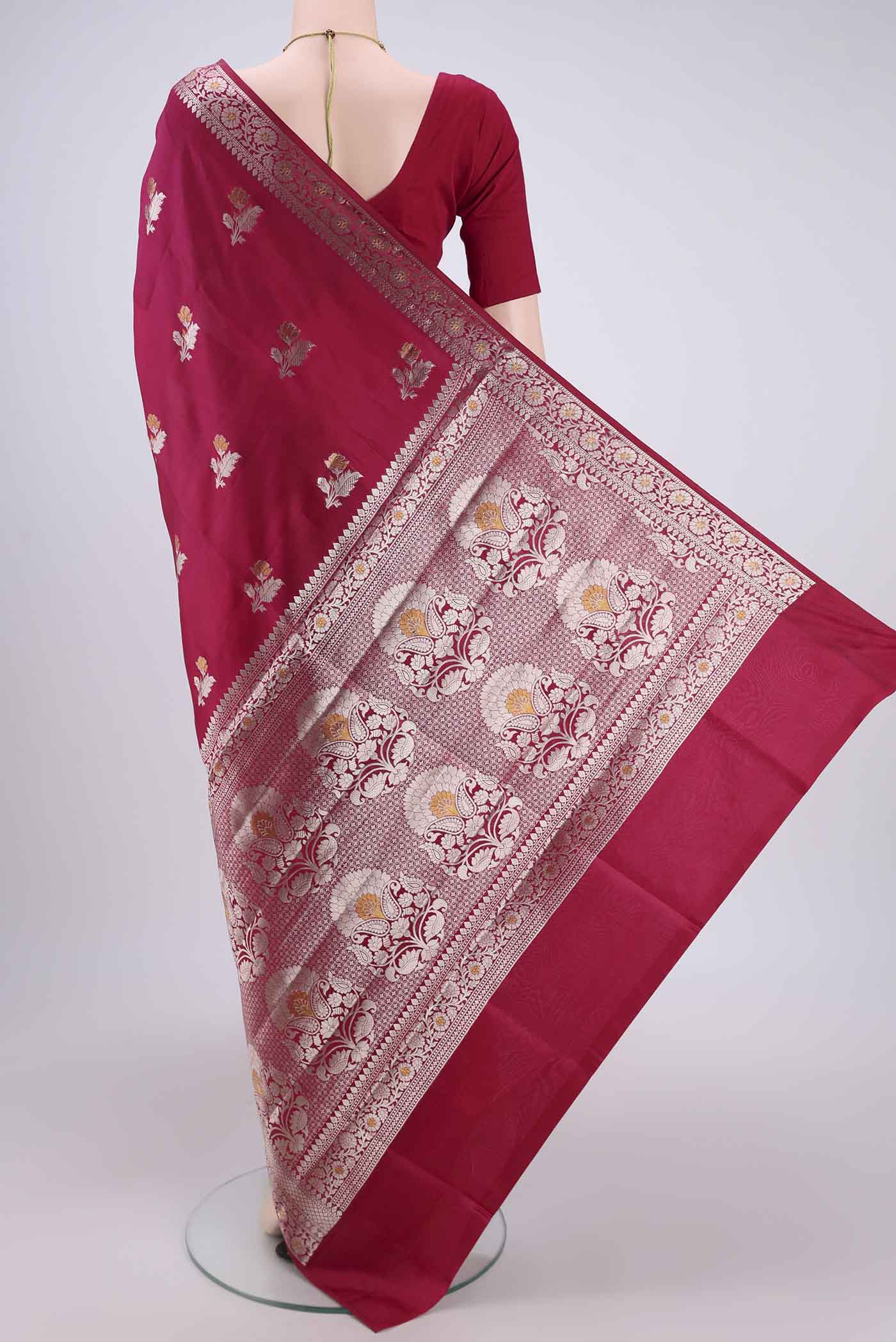 Flat view of Dark Pink Banarasi Raw Silk Saree with Zari Butta on the body and Zari Border. 