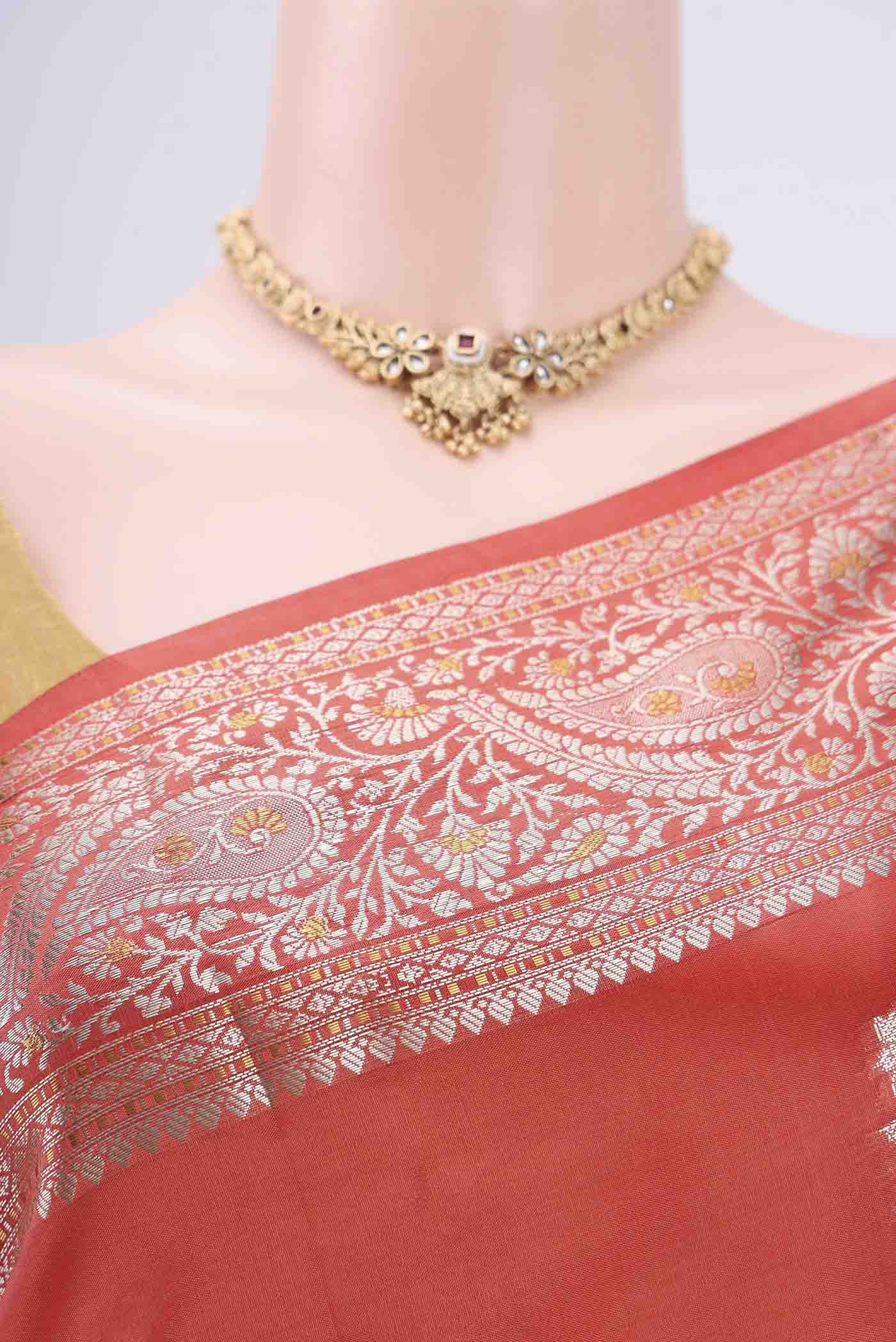 Border image of Peach Banarasi Raw Silk Saree with Zari Butta on the body and Zari Border. 