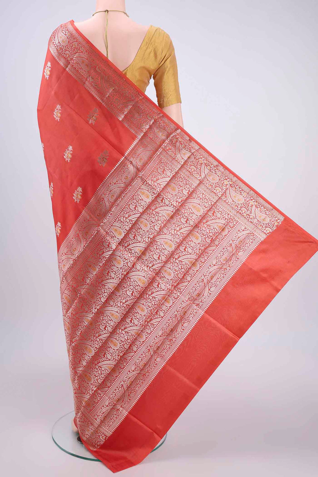 Flat view of Peach Banarasi Raw Silk Saree with Zari Butta on the body and Zari Border. 