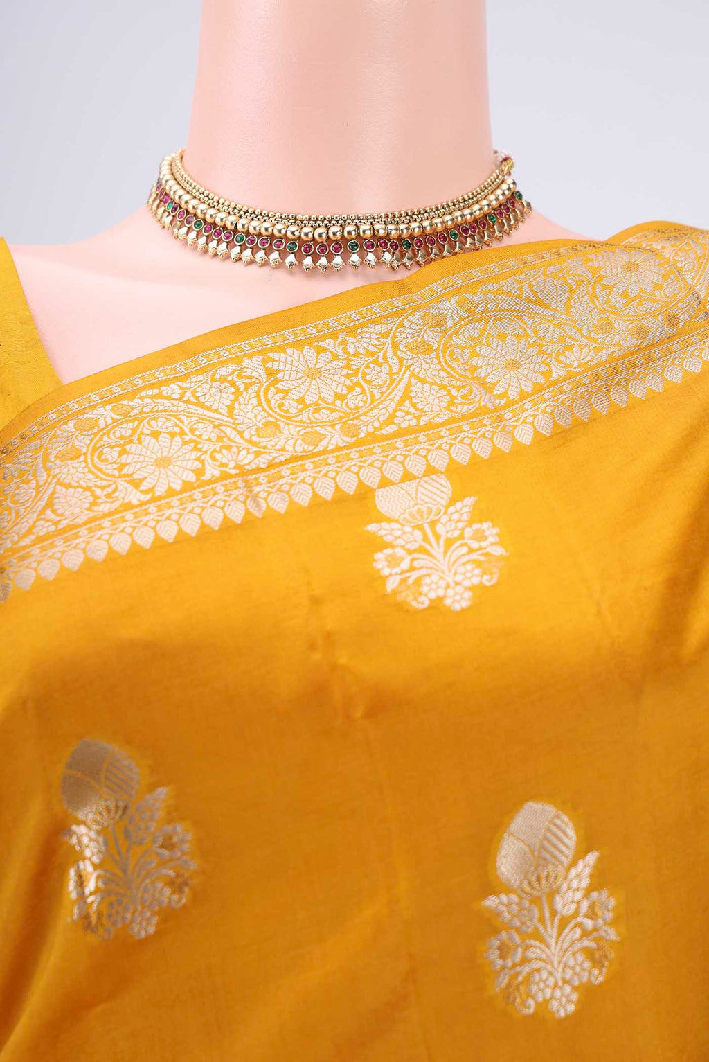 Border image of Yellow Banarasi Raw Silk Saree with Zari Butta on the body and Zari Border. 