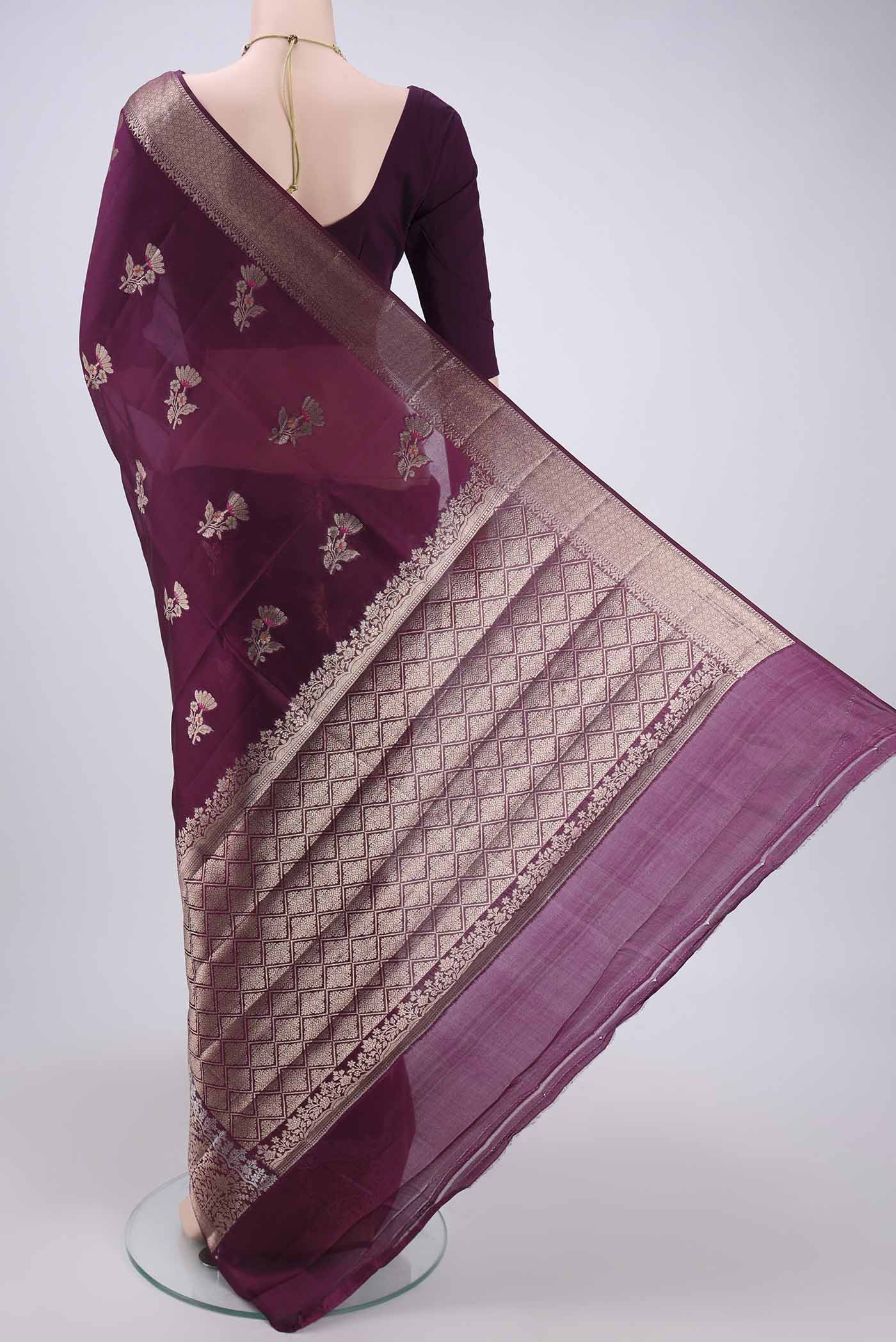Flat view of Magenta Banarasi Raw Silk Saree with Zari Butta on the body and Zari Border. 