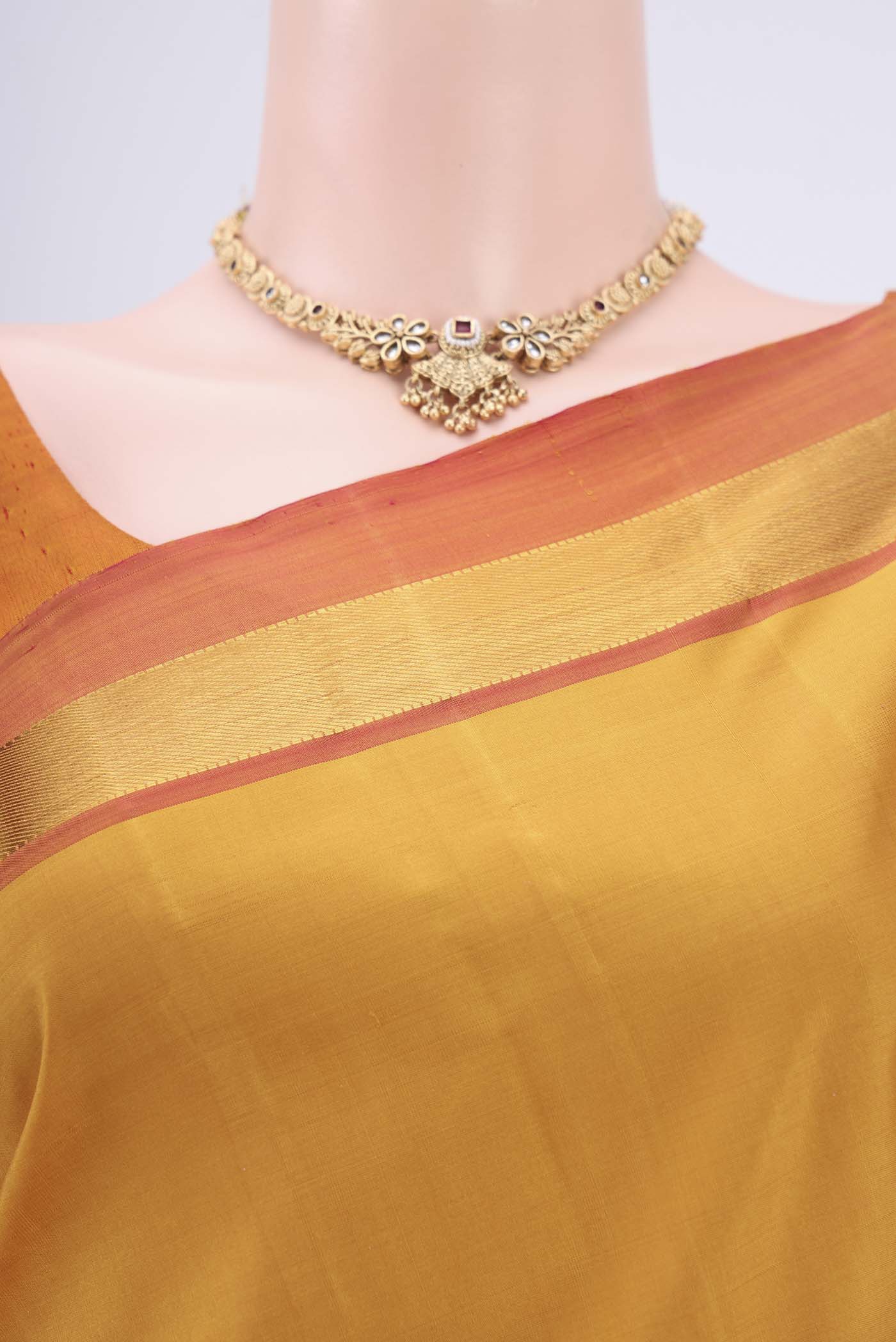 Border image of Mustard Dual Tone Kanjivaram Silk Saree with Zari Butta on the body and Zari Border. 
