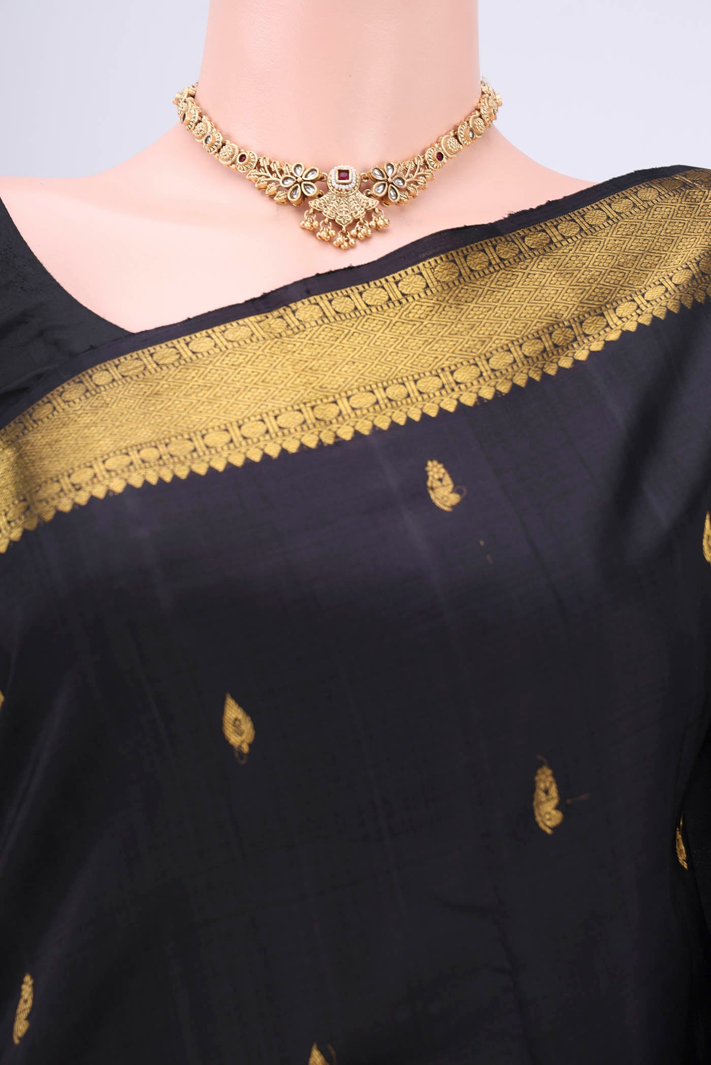 Border image of Black Kanchipuram Silk Saree with Plain Body and Zari Border. 