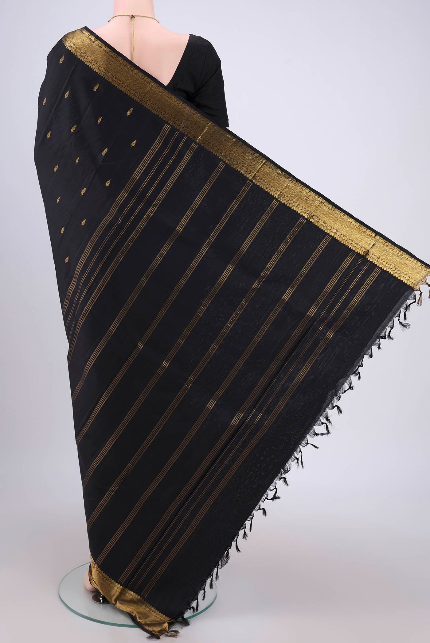Flat view of Black Kanchipuram Silk Saree with Plain Body and Zari Border. 